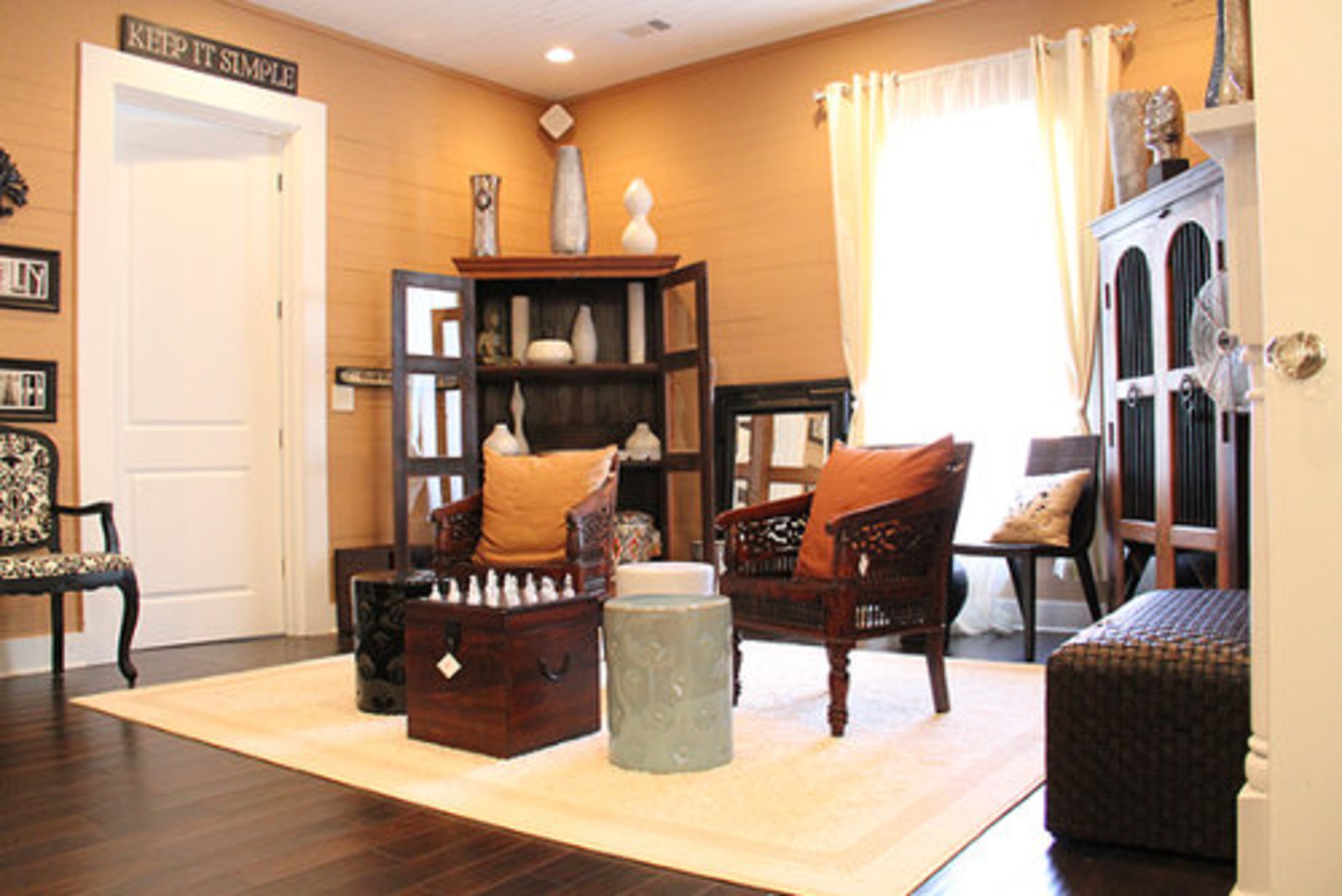 Tameka Raymond says she likes to keep things comfortable and simple. She describes her tastes as eclectic. She prefers prefers natural, reclaimed woods. Her store contains items from India and Indonesia.