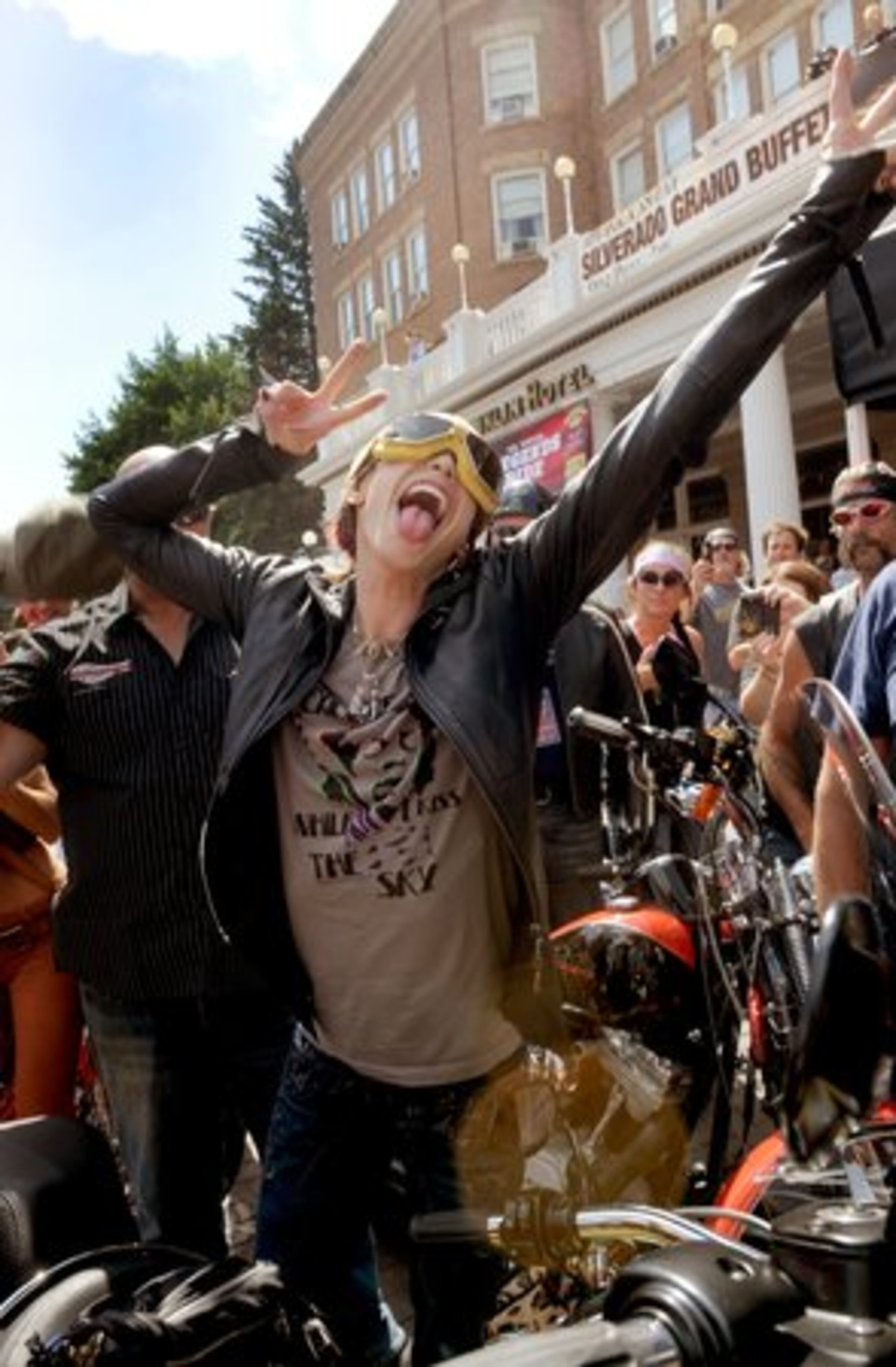 TYLER STRIKES a pose for fans at Deadwood. The ride raises funds for the Black Hills Children's Home Endowment Fund and the Sturgis Motorcycle Museum.
