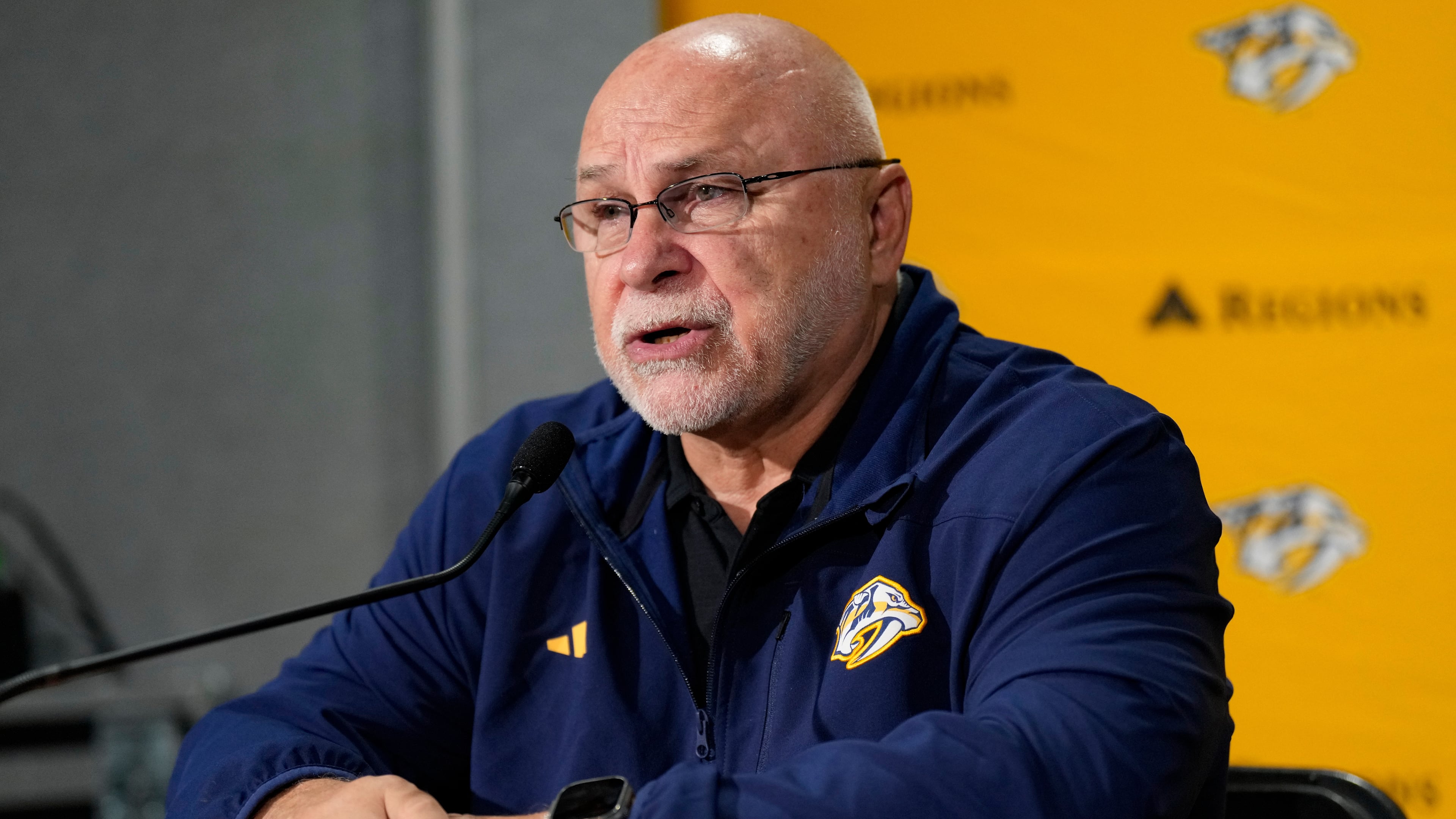 FILE - Nashville Predators general manager Barry Trotz responds to questions during a news conference at the team's NHL hockey training camp Sept. 19, 2024, in Nashville, Tenn. (AP Photo/George Walker IV, File)