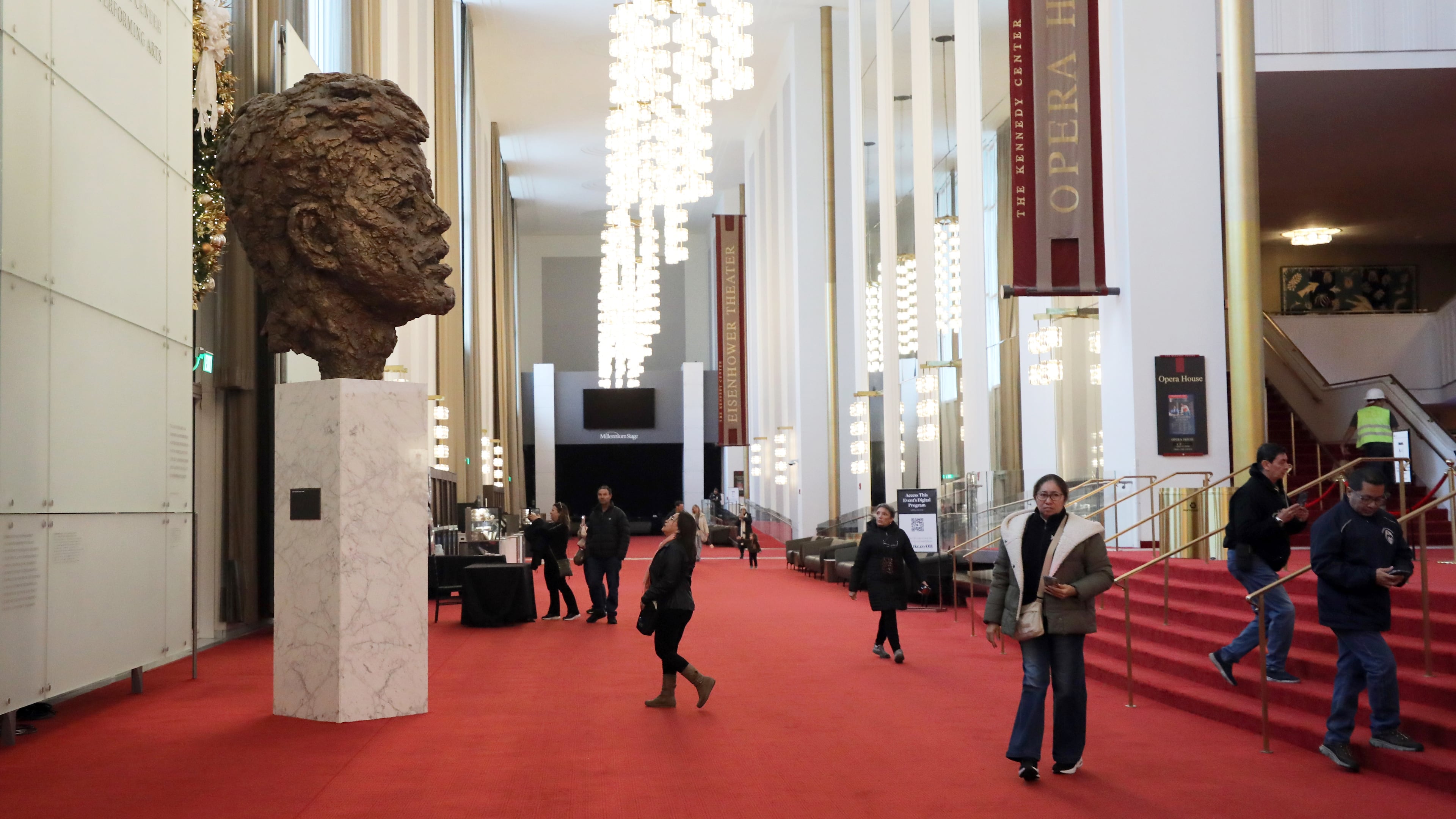 FILE - Visitors walk at the John F. Kennedy Memorial Center for the Performing Arts, Nov. 22, 2025, in Washington. (AP Photo/Rahmat Gul, File)