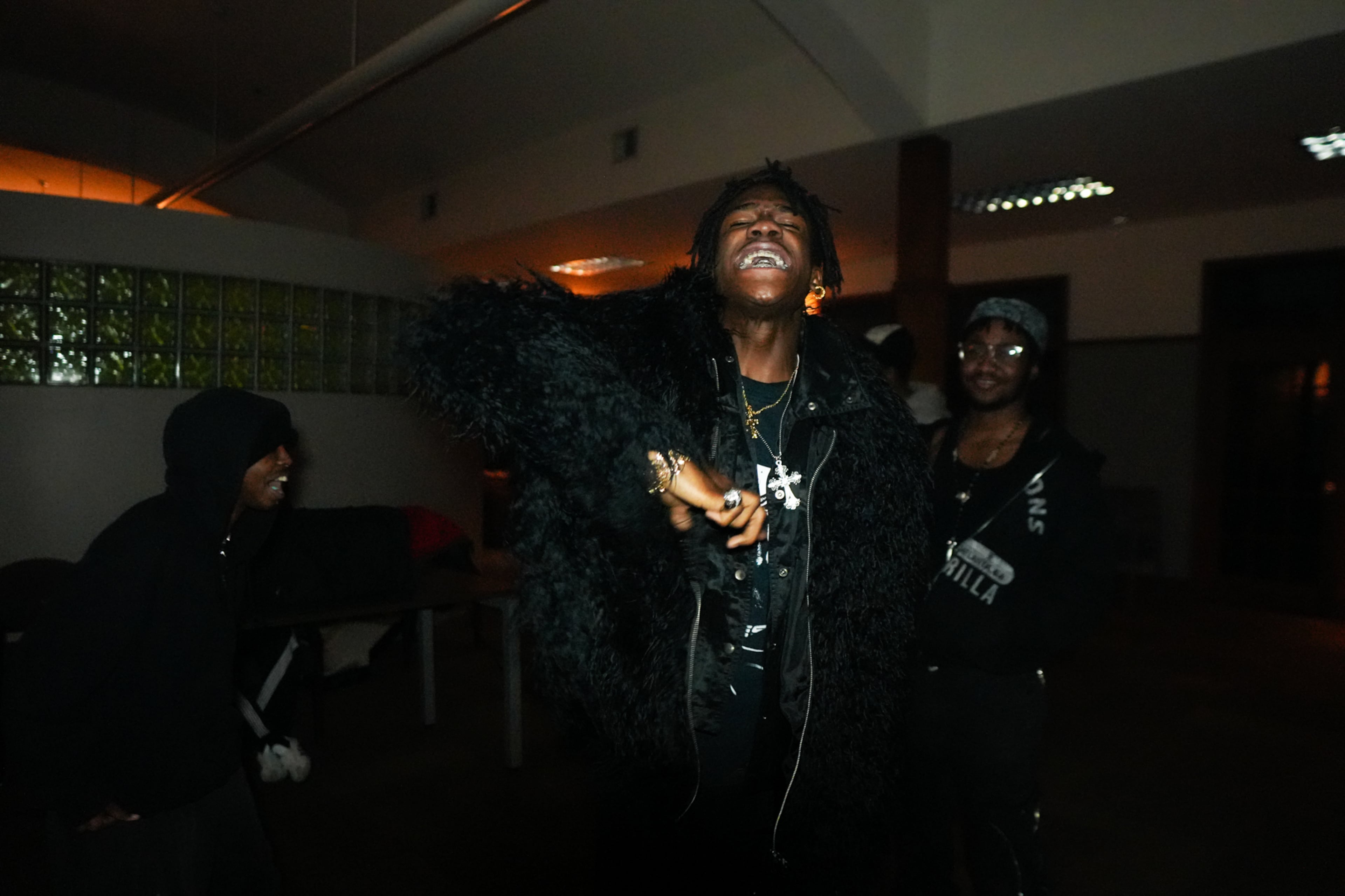 18-year-old Abram Sullivan wore a black fur jacket, upside-down pants and Rick Owens shoes to compete in the Playboi Carti look-alike contest on Sunday, Dec. 29, 2024. The event was hosted by Atlanta-based media company Frictionn. Photo credit: James I. Smith III