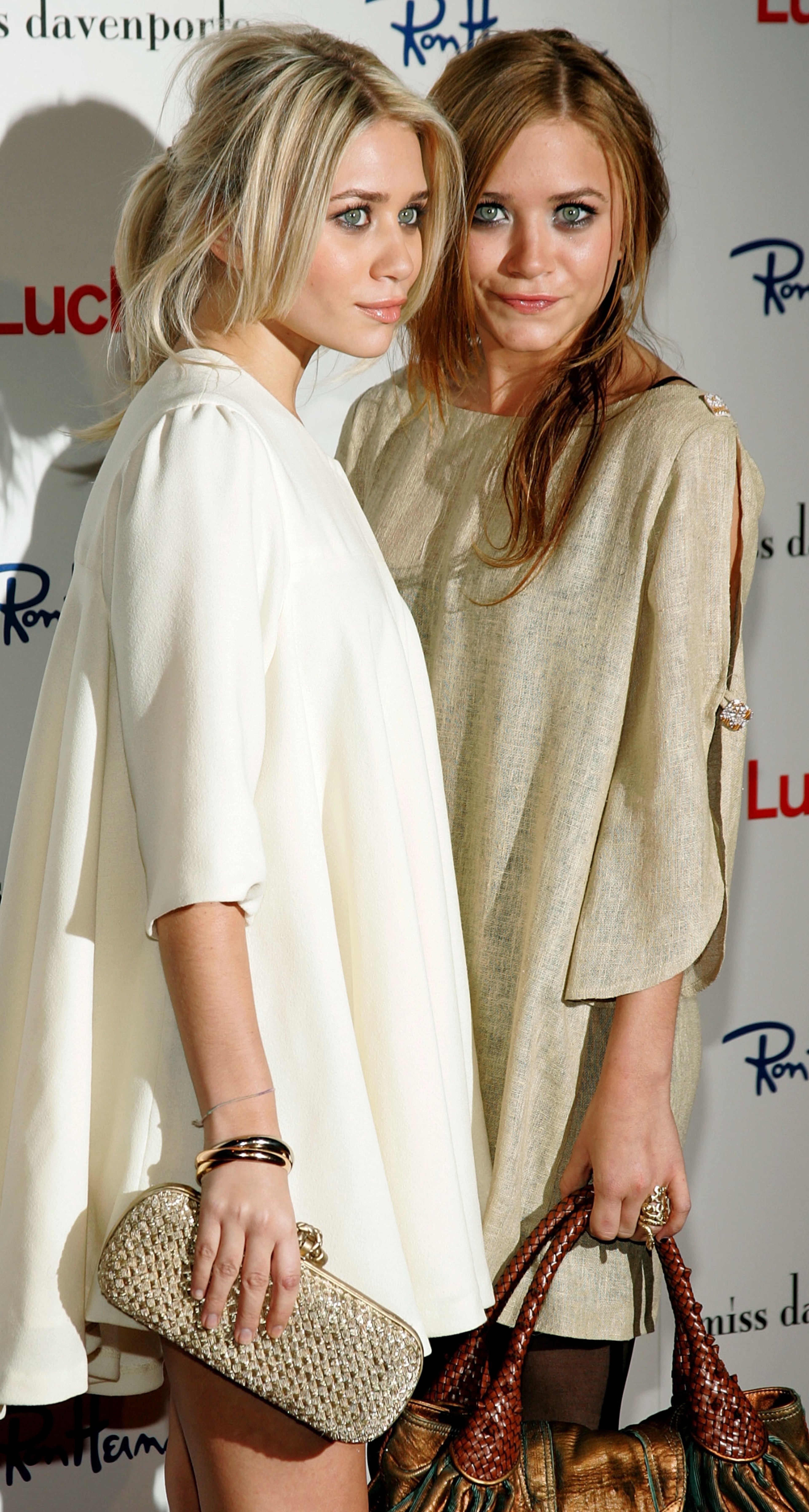 Actresses Ashley and Mary Kate (R) Olsen arrive at the Miss Davenporte Trunkshow hosted by the Olsen's and Lucky Magazine at Ron Herman November 17, 2005 in Los Angeles, California. (Photo by Mark Mainz/Getty Images)