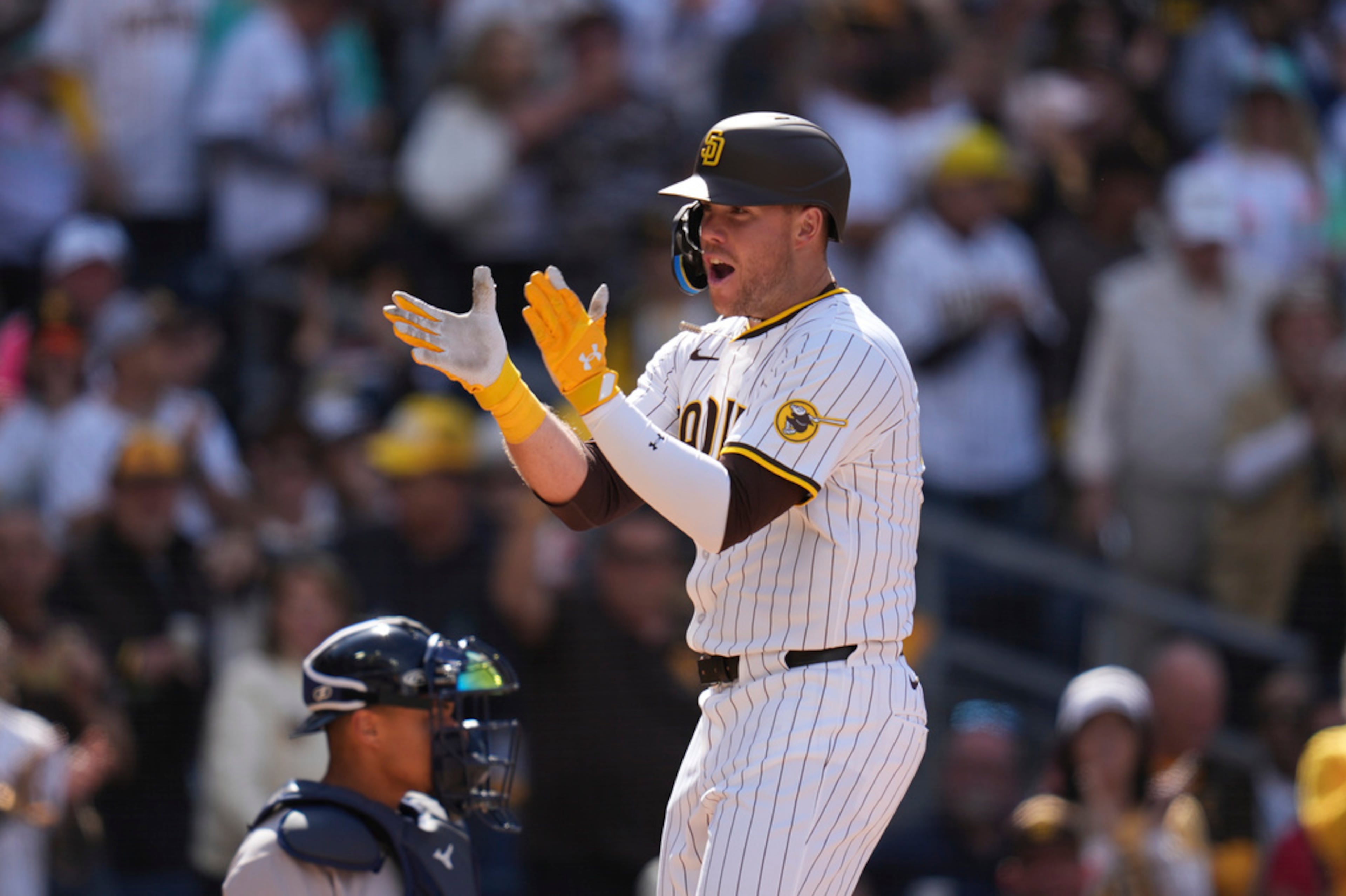 San Diego Padres' Gavin Sheets celebrates his home run during the seventh inning of an opening-day baseball game against the Atlanta Braves, Thursday, March 27, 2025, in San Diego. (AP Photo/Gregory Bull)