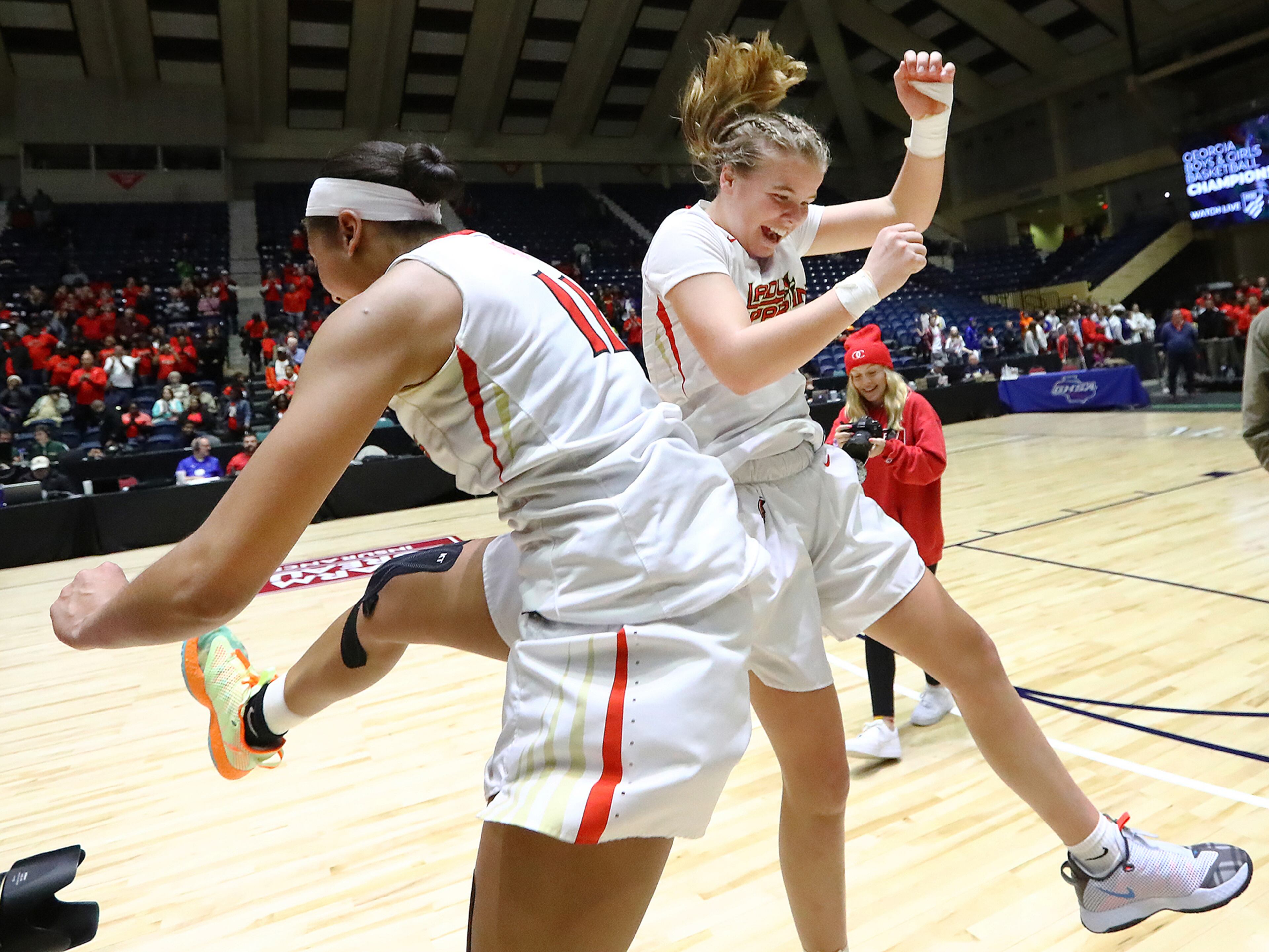 March 5, 2020 Macon: Greater Atlanta Christian players Ava Irvin (left) and Molly Pritchard celebrate defeating Beach 54-44 to win the Class AAA girls state basketball championship on Thursday, March 5, 2020, in Macon. Curtis Compton ccompton@ajc.com