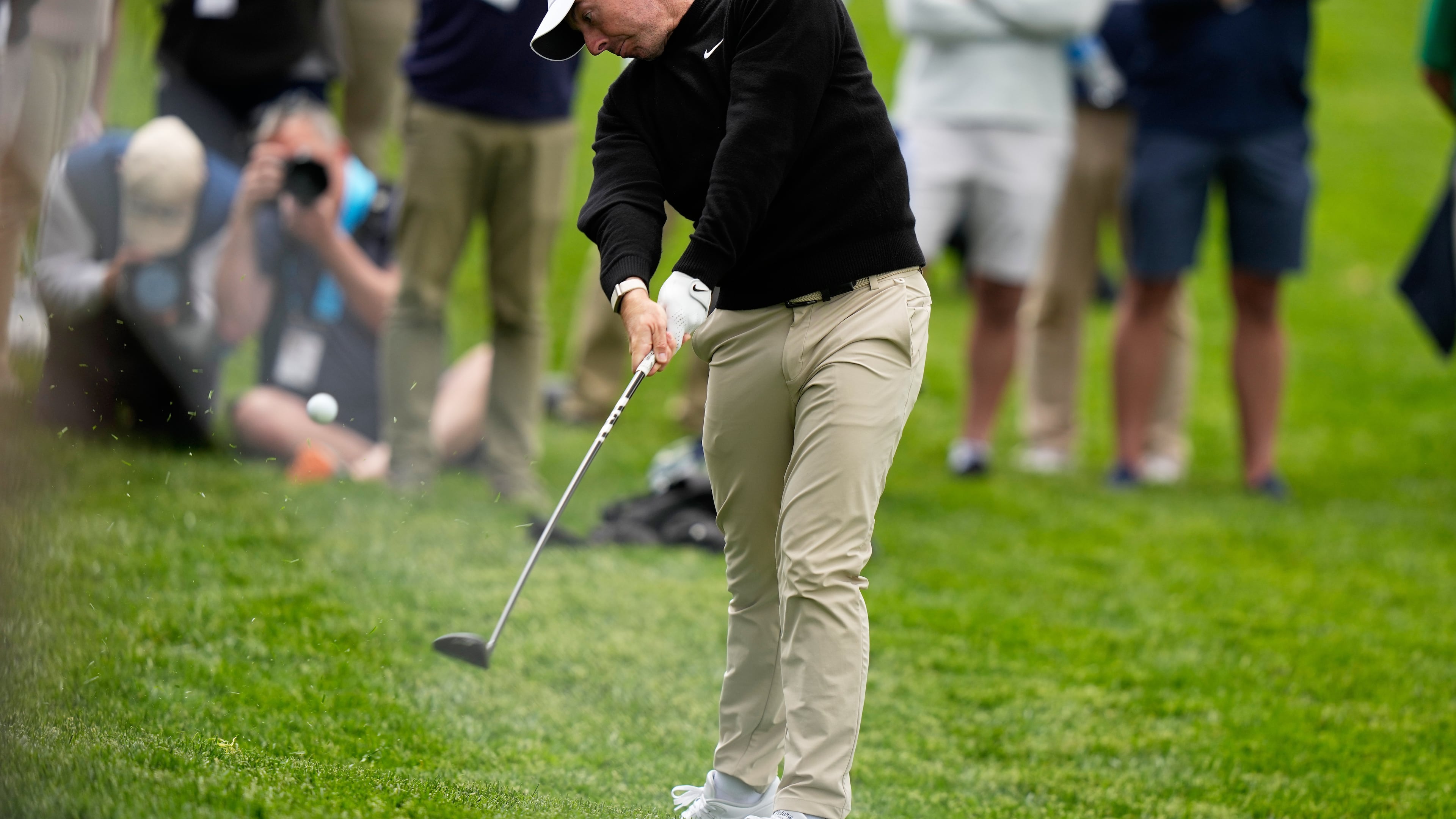 Rory McIlroy, of Northern Ireland, hits from the rough on the ninth hole during the first round of the PGA Championship golf tournament practice round at Aronimink Golf Club, Thursday, May 14, 2026, in Newtown Square, PA. (AP Photo/Frank Franklin II)