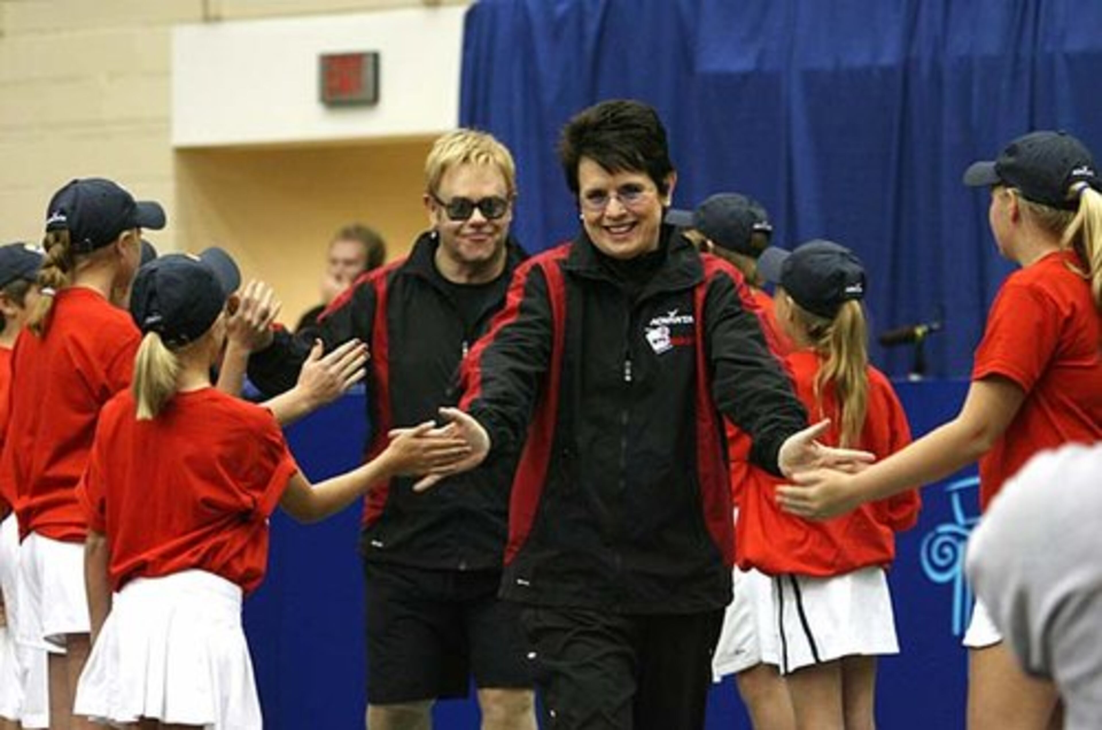 Hosts tennis legend Billie Jean King and music legend Sir Elton John are introduced onto the court during the Advanta World Team Tennis Smash Hits event at Kennesaw State University. The fund-raiser benefitted the Elton John AIDS Foundation Elton John Aids Foundation and Atlanta Aids Partnership Fund.