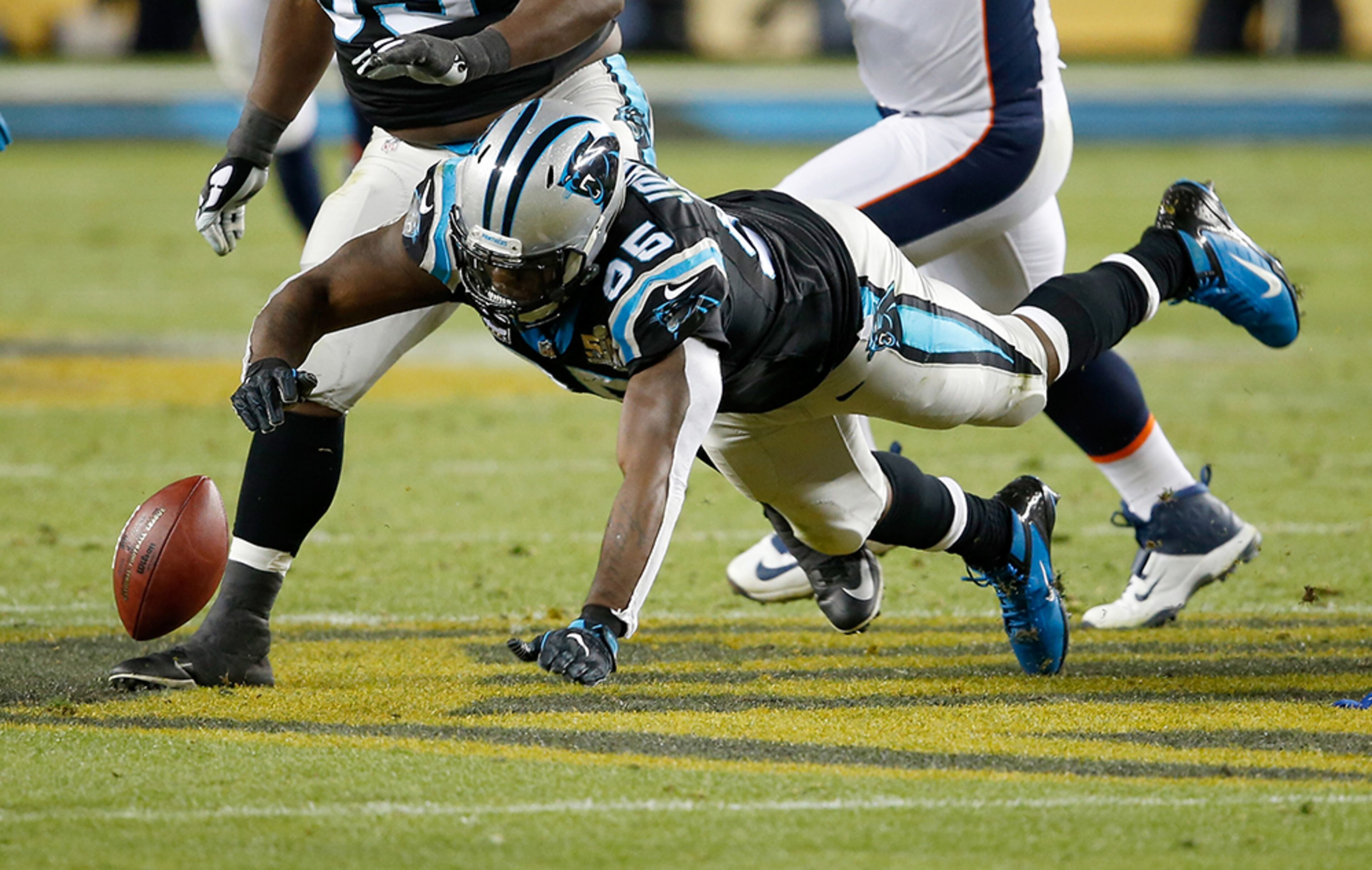 Charles Johnson (95) of the Carolina Panthers dives to recover a fumble by quarterback Peyton Manning (18) of the Denver Broncos during Super Bowl 50 at Levi's Stadium on Feb. 7, 2016, in Santa Clara, Calif.