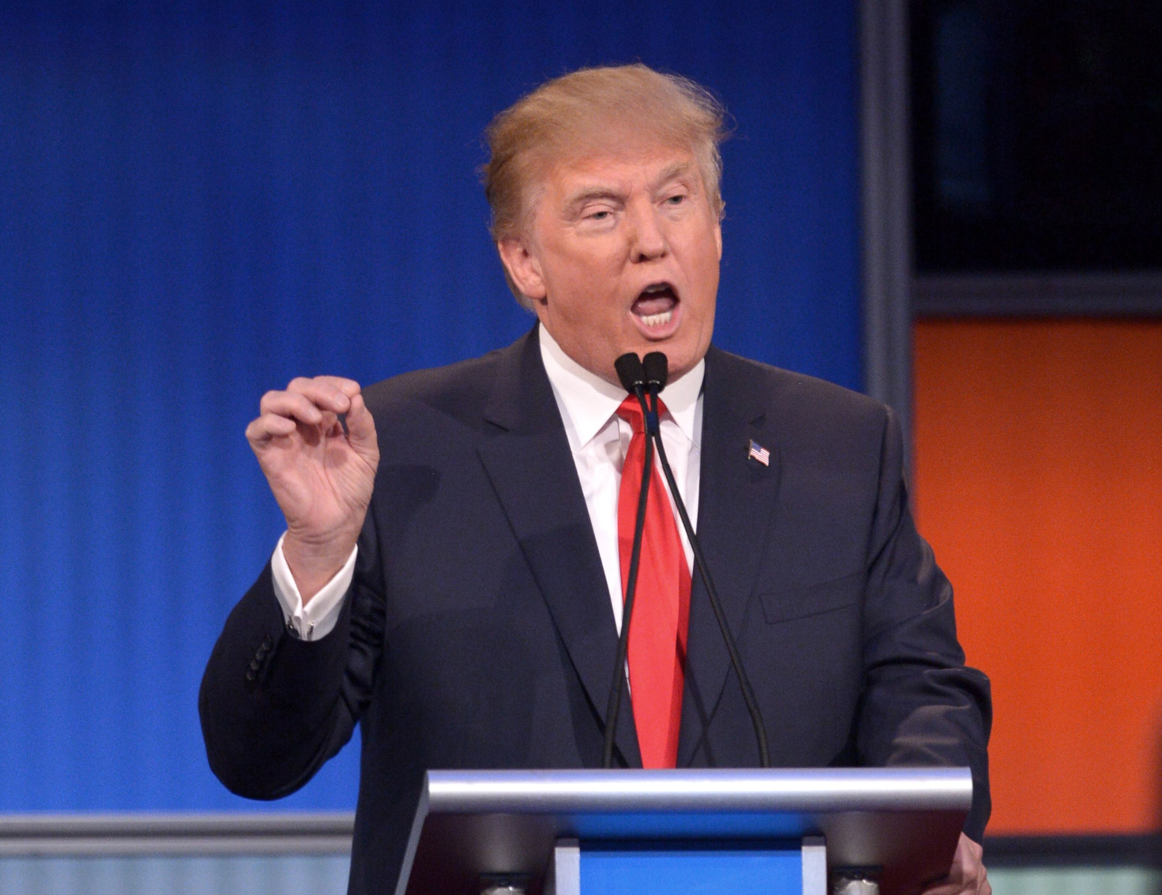 Republican presidential hopeful Donald Trump speaks during the prime time Republican presidential primary debate on August 6, 2015 at the Quicken Loans Arena in Cleveland, Ohio. AFP PHOTO/MANDEL NGAN (Photo credit should read MANDEL NGAN/AFP/Getty Images)
