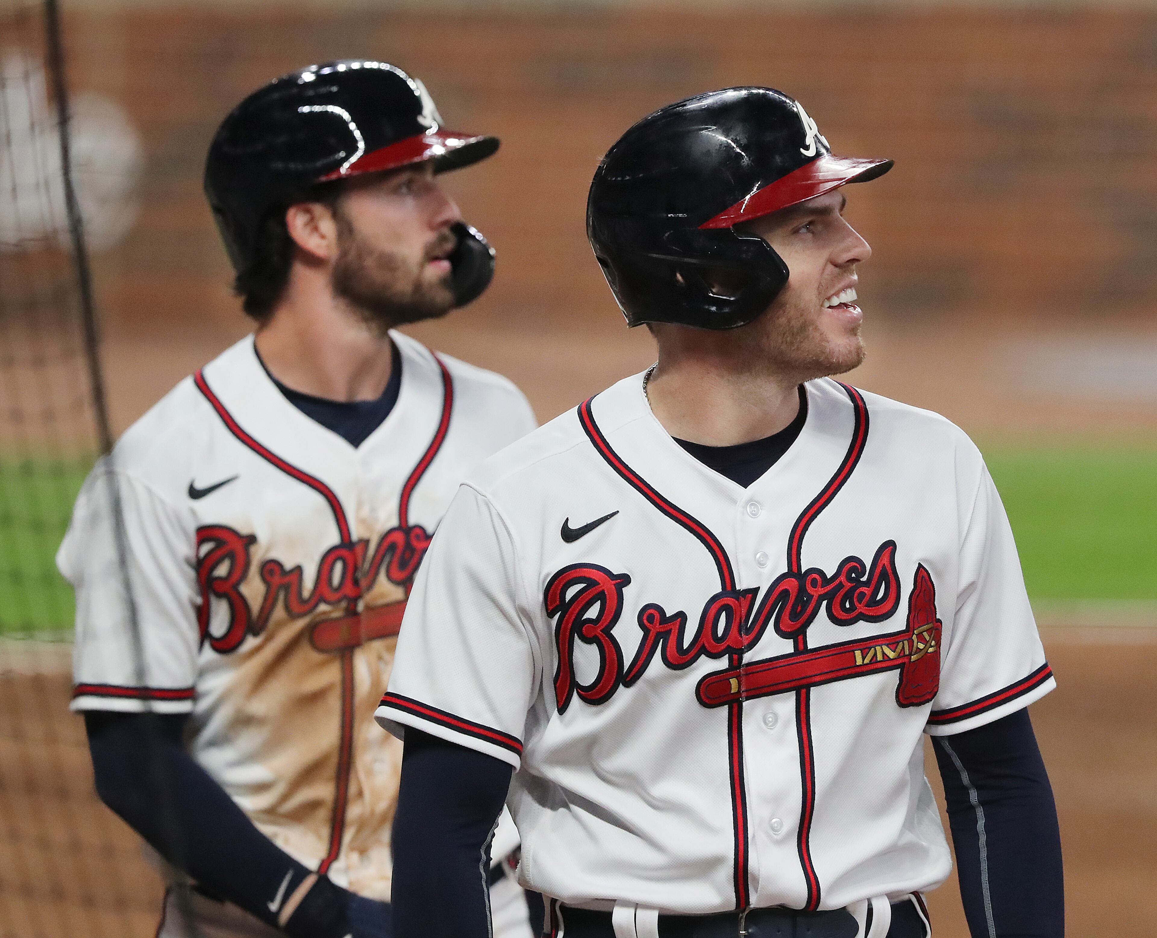Braves' Freddie Freeman (right) is all smiles scoring along with Dansby Swanson on a 2-RBI double by Marcell Ozuna for a 4-0 lead over the Miami Marlins during the fifth inning in a MLB baseball game on Tuesday, Sept. 22, 2020 in Atlanta. “Curtis Compton / Curtis.Compton@ajc.com”