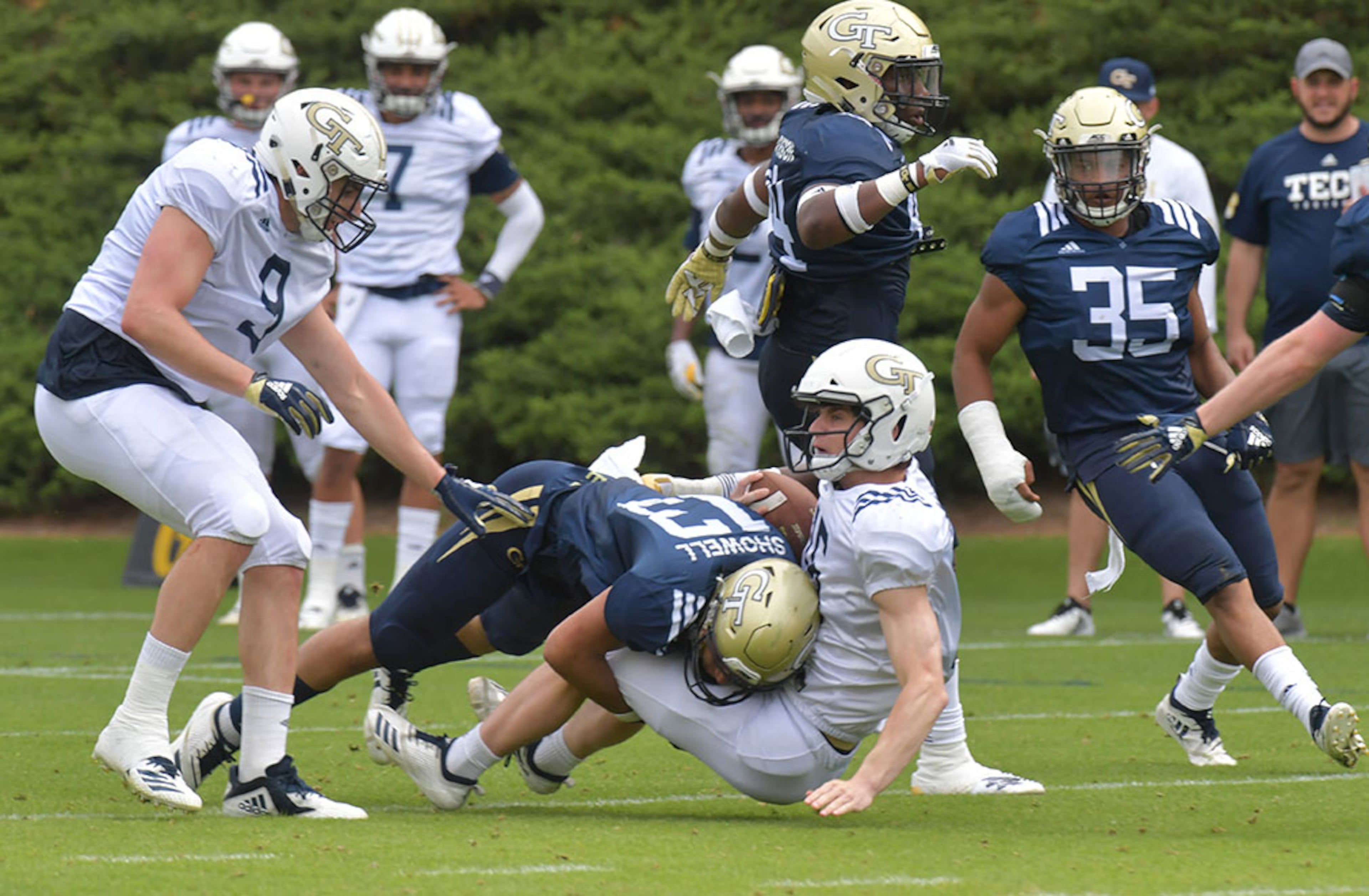 Georgia Tech wide receiver Liam Byrne (16) gets tackled by Georgia Tech defensive back Avery Showell (13) during a practice session Thursday, April 18, 2019, at Georgia Tech's football outdoor practice field in Atlanta.