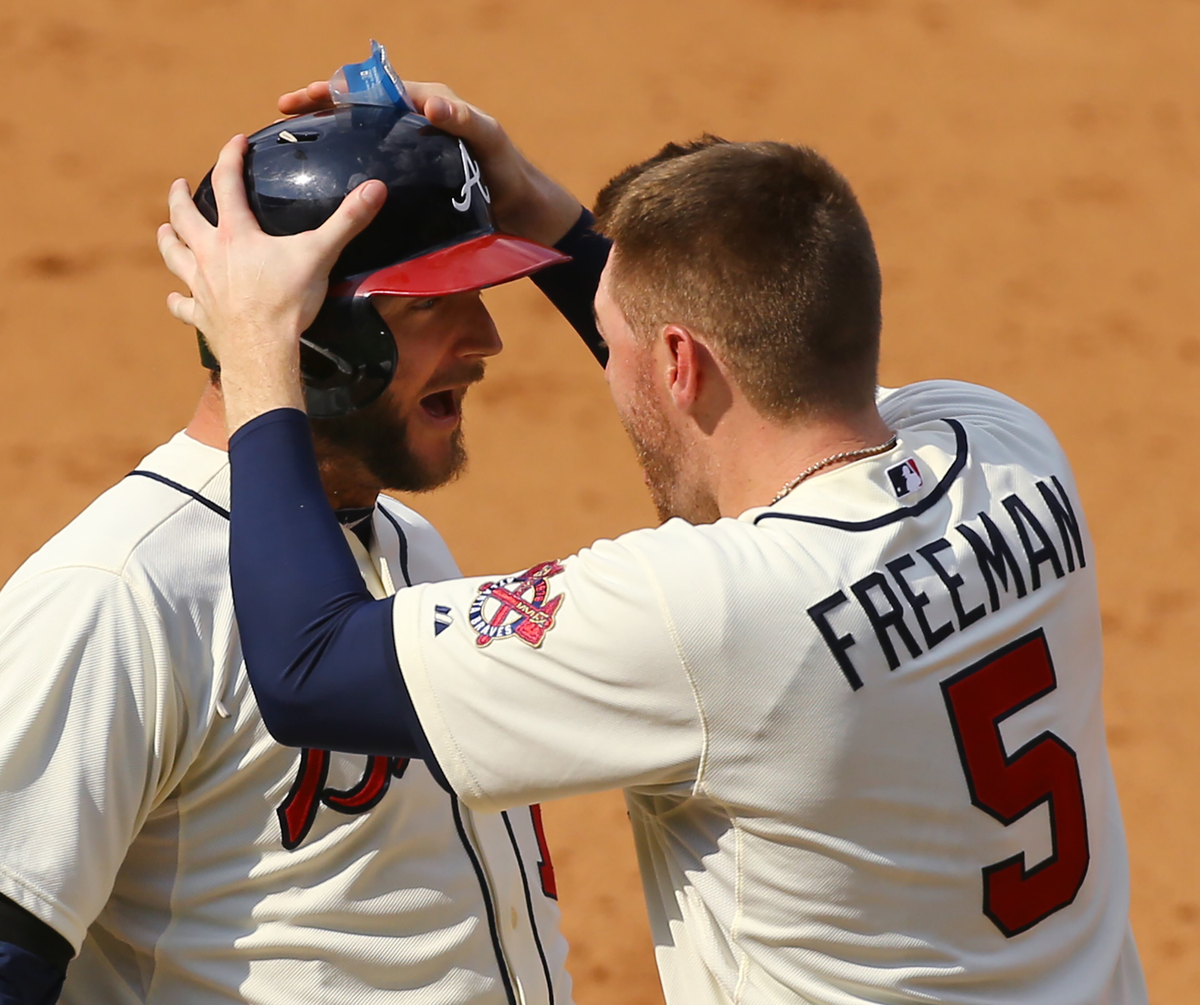 Number 6: You did it -- Freddie Freeman (right) grabs A.J. Pierzynski after the catcher’s game-winning hit on Sept. 20. Photo by Curtis Compton.