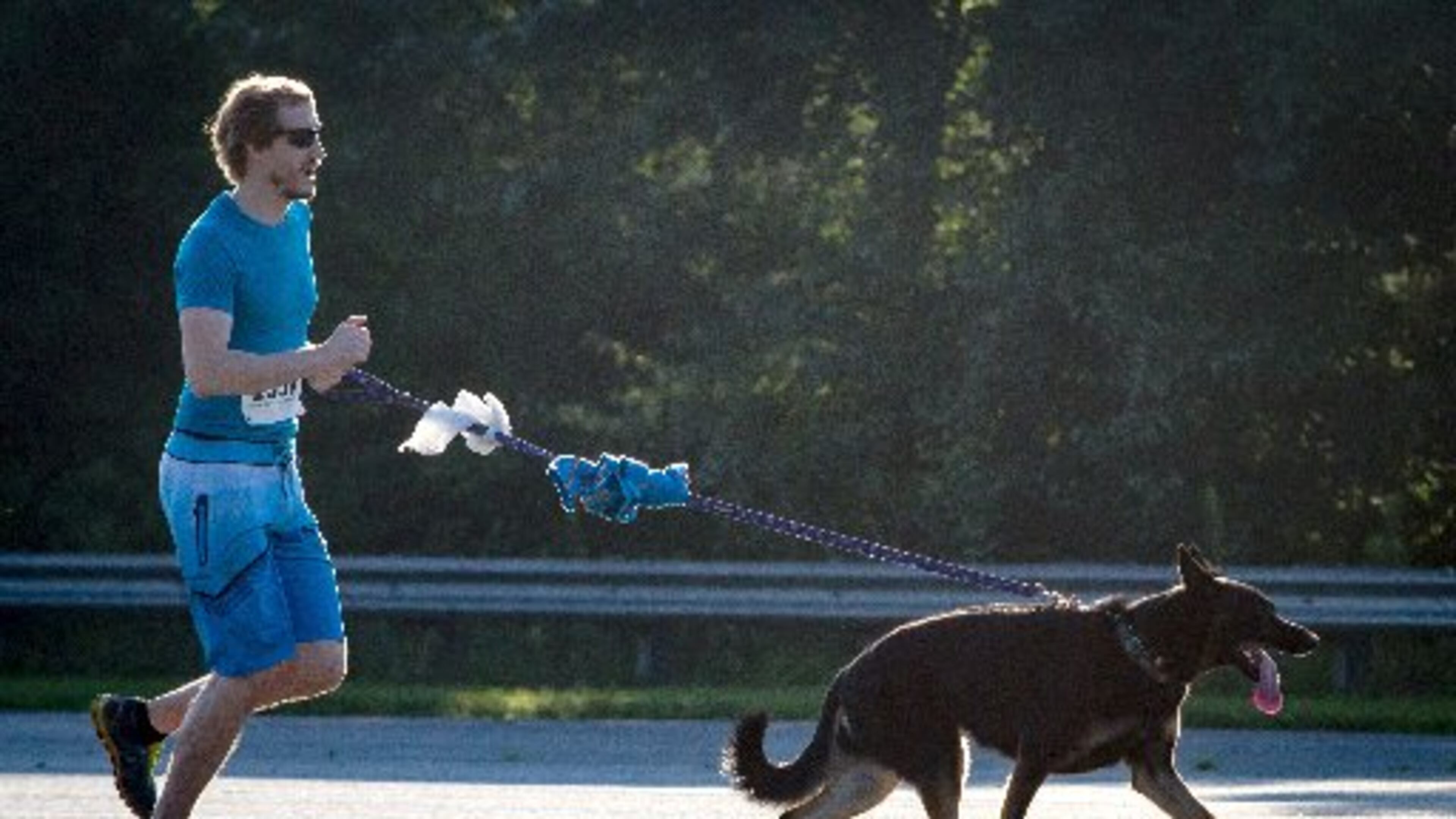 Andrew Knrdeiski and his dog Minna run during the Fast and Furry 5K fun run at Cobb County Animal Control in Marietta, GA Saturday morning June 30, 2018.