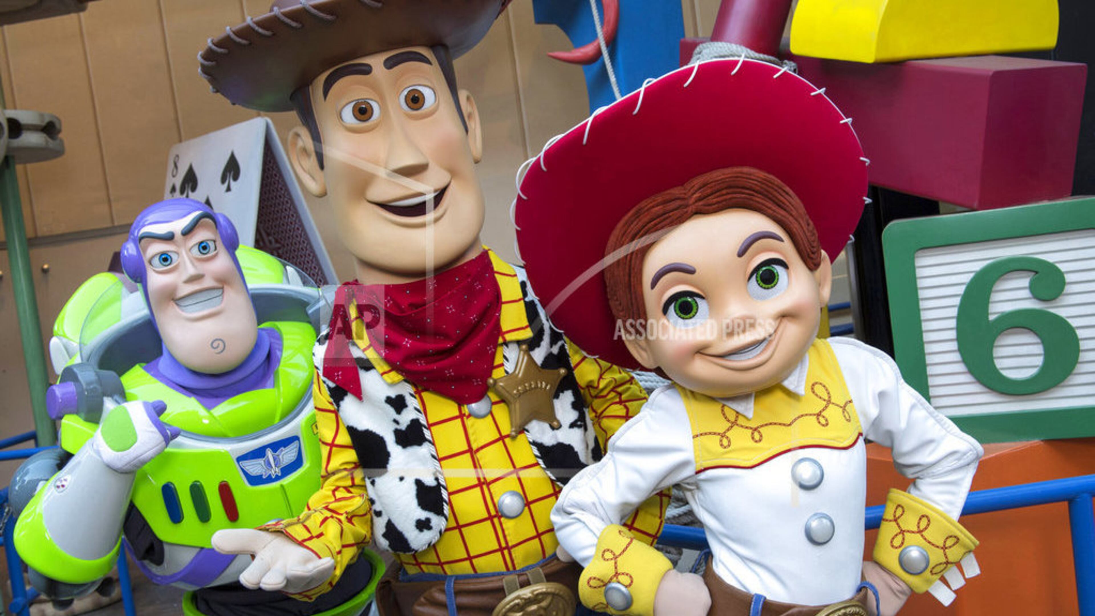 This undated photo provided by Walt Disney World, shows characters from left, Buzz Lightyear, Sheriff Woody and Jessie the Yodeling Cowgirl. The trio will interact with guests in the new Toy Story Land set to open June 30, 2018 at Disney's Hollywood Studios in Lake Buena Vista, Fla. (Divid Roark/Walt Disney World via AP)
