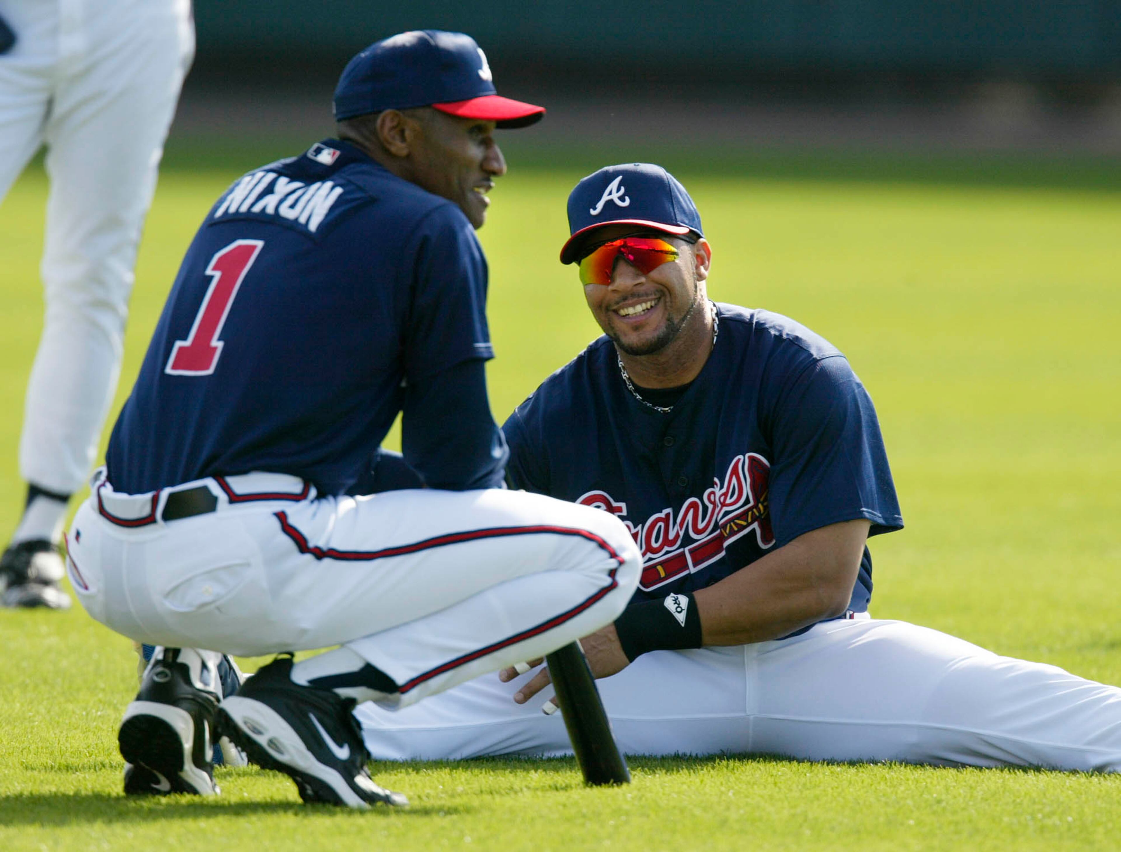 Feb. 2, 2002: Atlanta Braves outfielder Gary Sheffield (right) talks with Nixon during workouts in Lake Buena Vista, Fla.