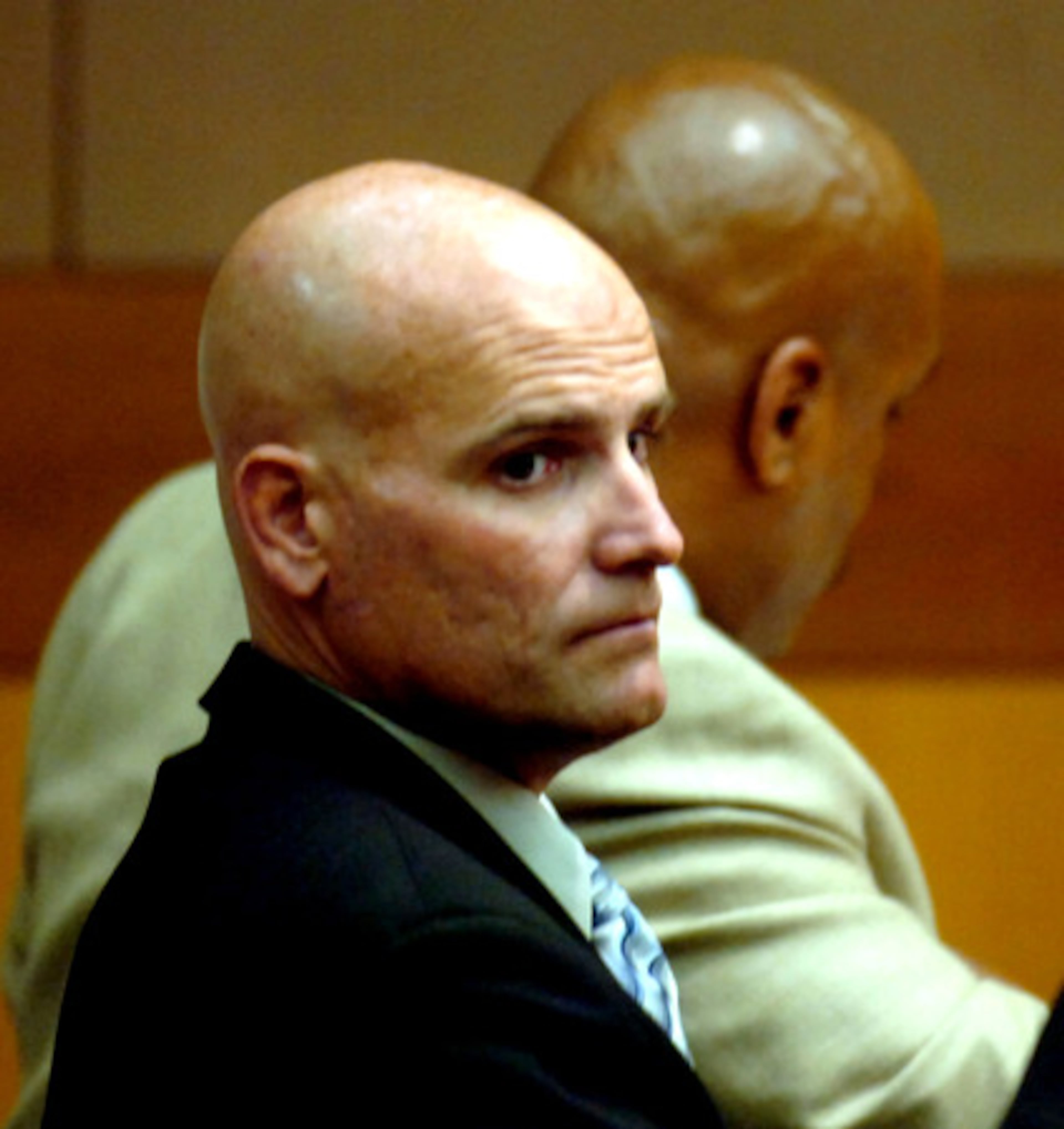 Narcotics Officer Gregg Junnier chose to remain silent during his plea, but his outspoken lawyer blasted top officials.