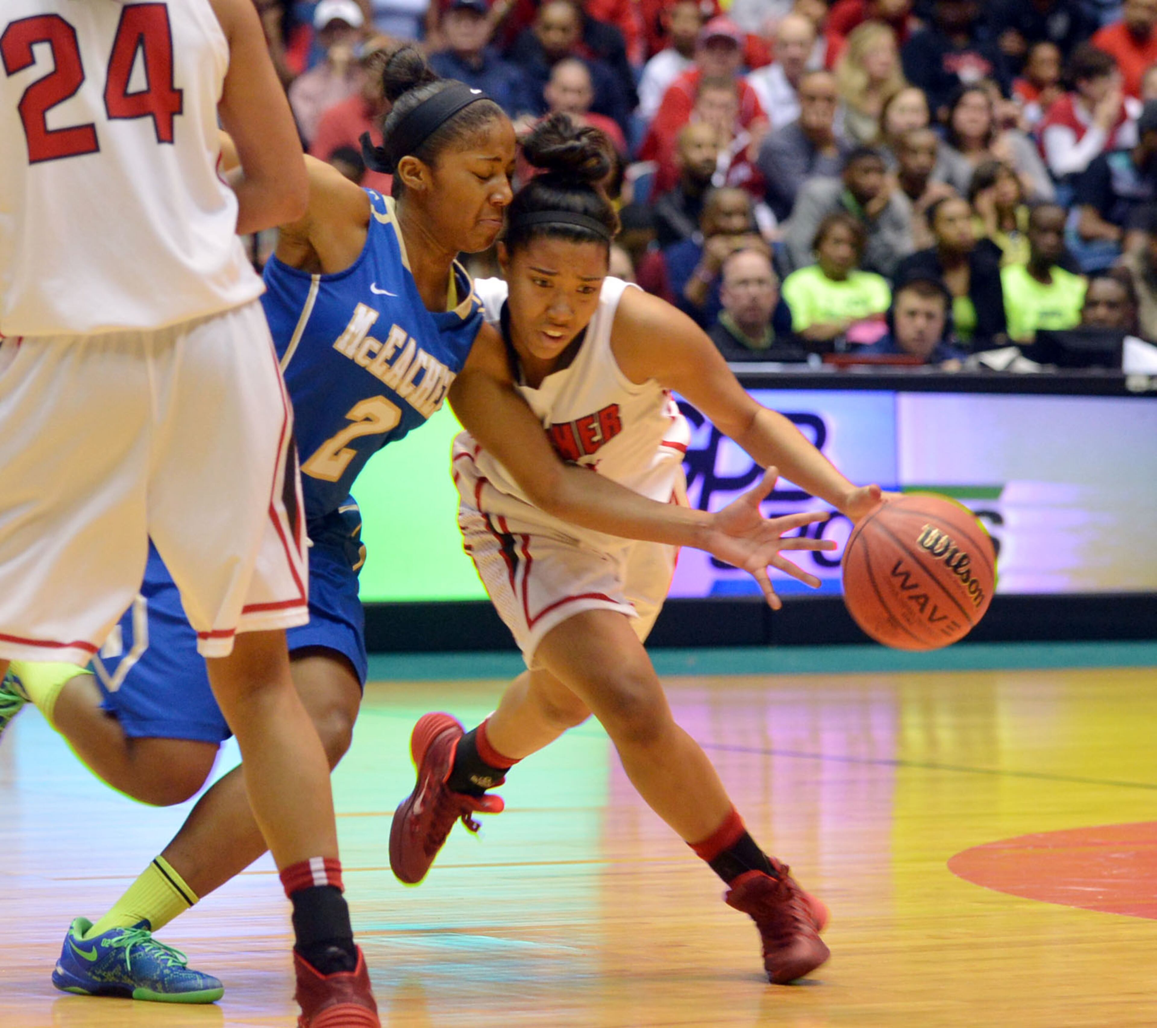 Archer Tigers Madison Newby #23 looks for room as McEachern Indians Te'a Cooper #2 defends during action in the first half. Coverage of the Class AAAAAA girls basketball championship between the McEachern Indians and Archer Tigers at the Macon Coliseum Saturday, March 8, 2014. McEachearn led 39-35 at the half.