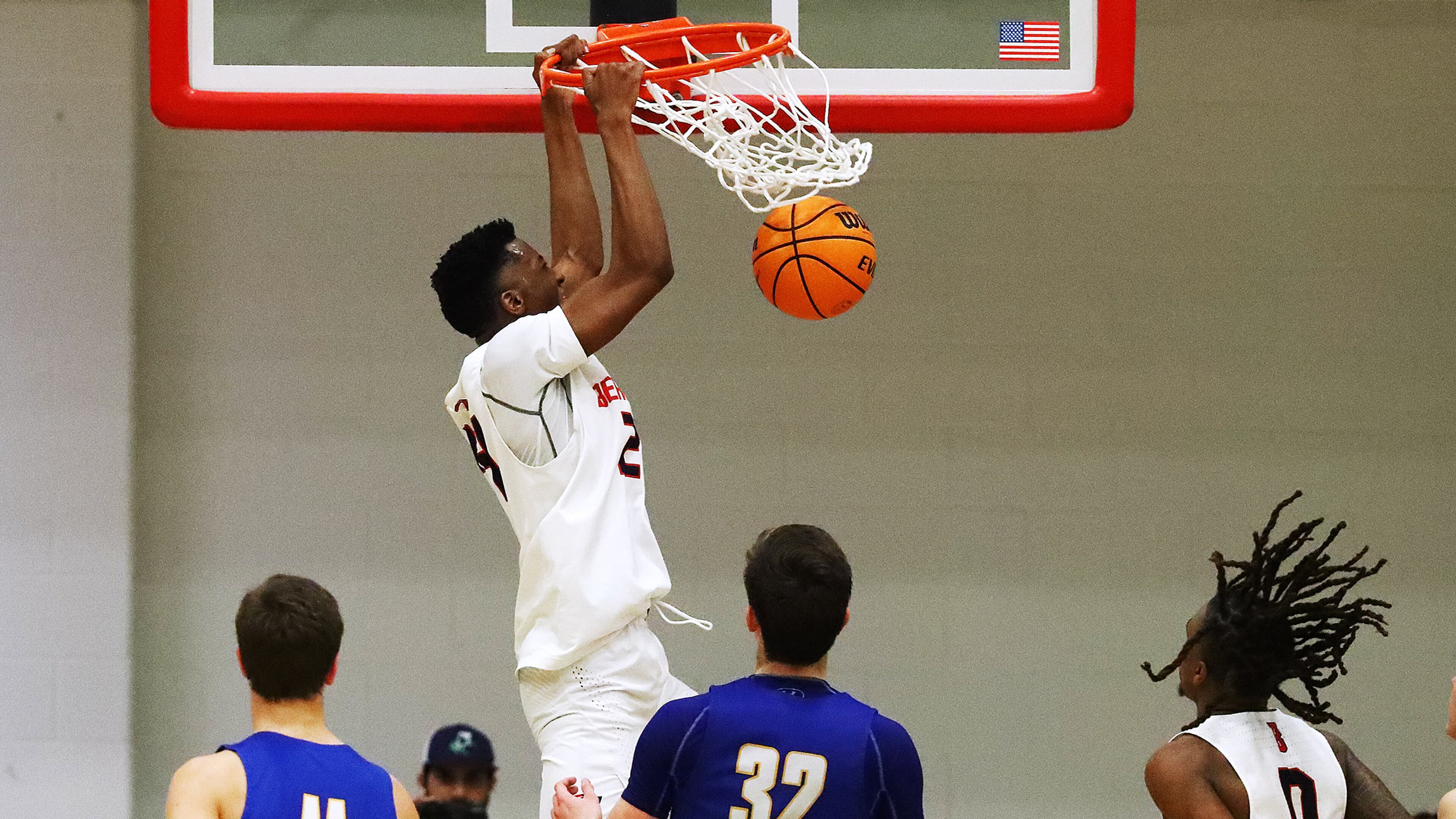 Berkmar wing Bo Hurns slams for two on a lob pass from Jameel Rideout (right) past Etowah defenders. Berkmar advanced with a 61-39 victory over Etowah. (Curtis Compton / Curtis.Compton@ajc.com)`