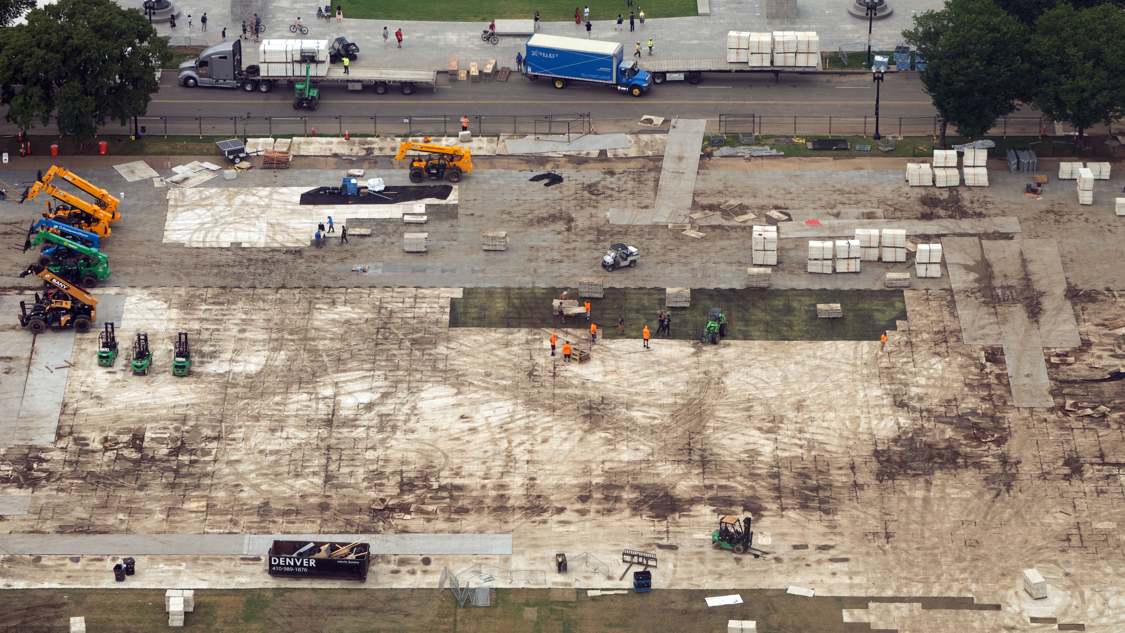 FILE - Workers dismantle structures from Salute to America, an Independence Day event honoring the nation's 250th anniversary, as seen from the Washington Monument, on July 10, 2026, in Washington. (AP Photo/Mark Schiefelbein, File)