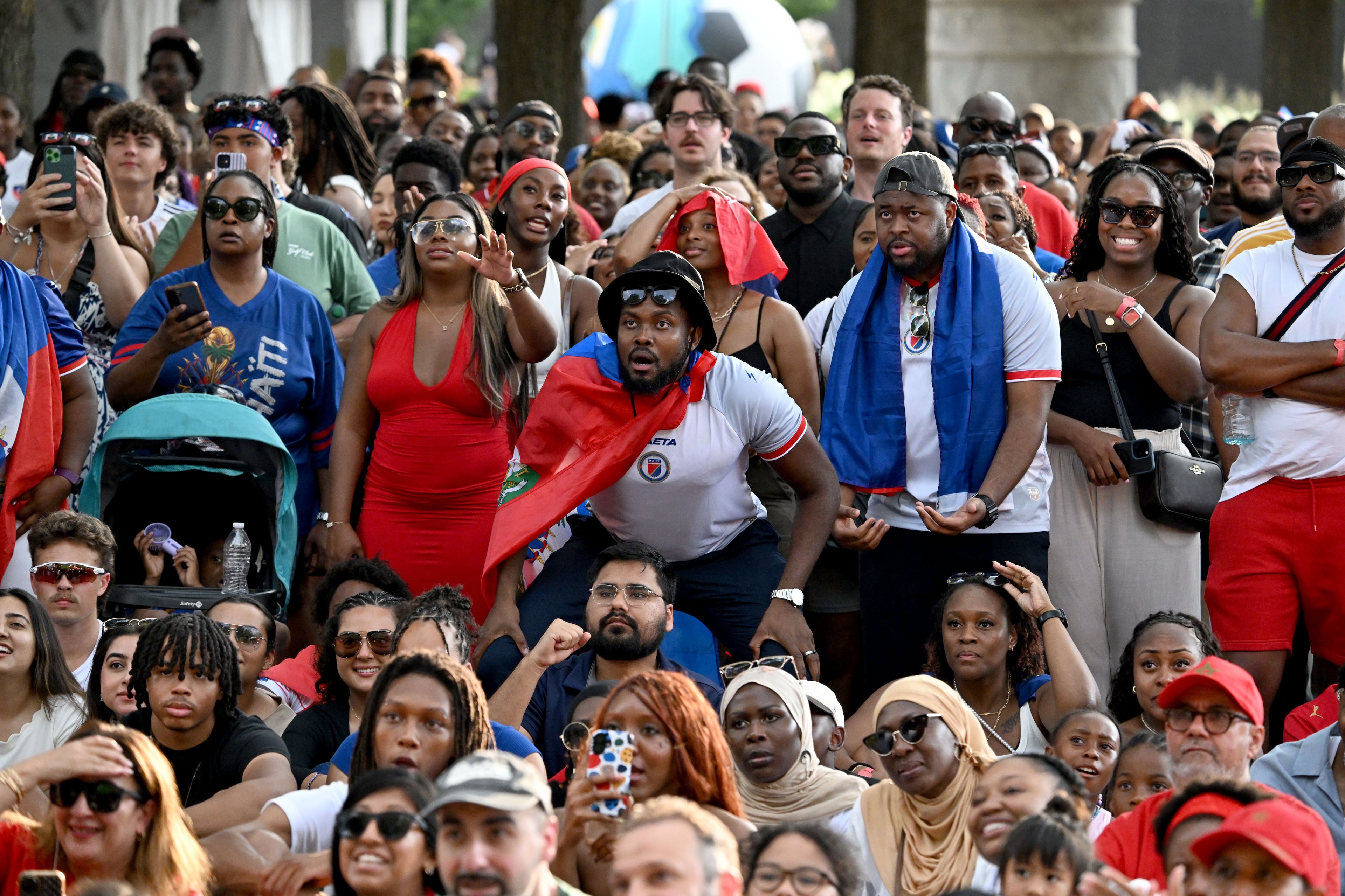 Haiti fans react as they gather to watch the match between Morocco vs. Haiti at the FIFA Fan Festival in Centennial Olympic Park on Wednesday, June 24, 2026, in Atlanta. (Hyosub Shin/AJC)