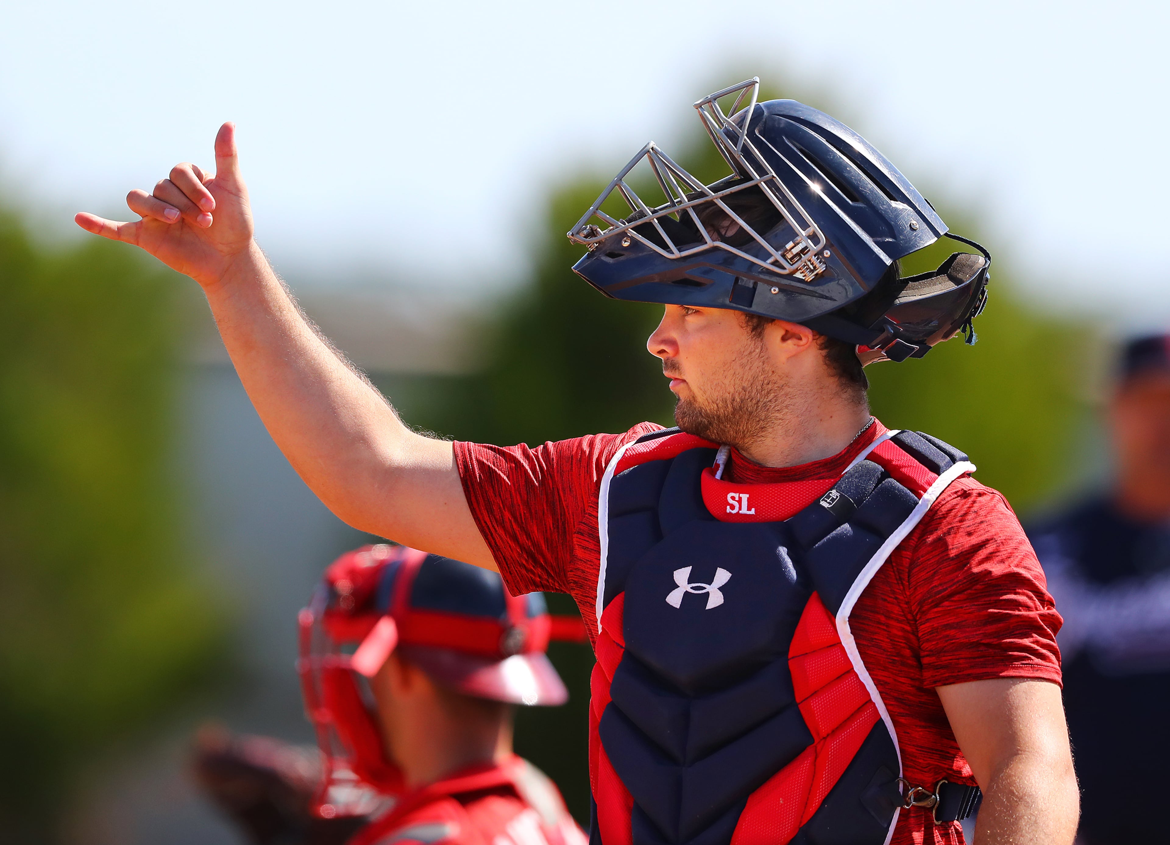 030622 North Port: Atlanta Braves top prospect catcher Shea Langeliers gives a pitcher the OK signal to get started at the practice pitching mounds on the first day of Braves minor league spring training camp on Sunday, March 6, 2022, in North Port. “Curtis Compton / Curtis.Compton@ajc.com”`