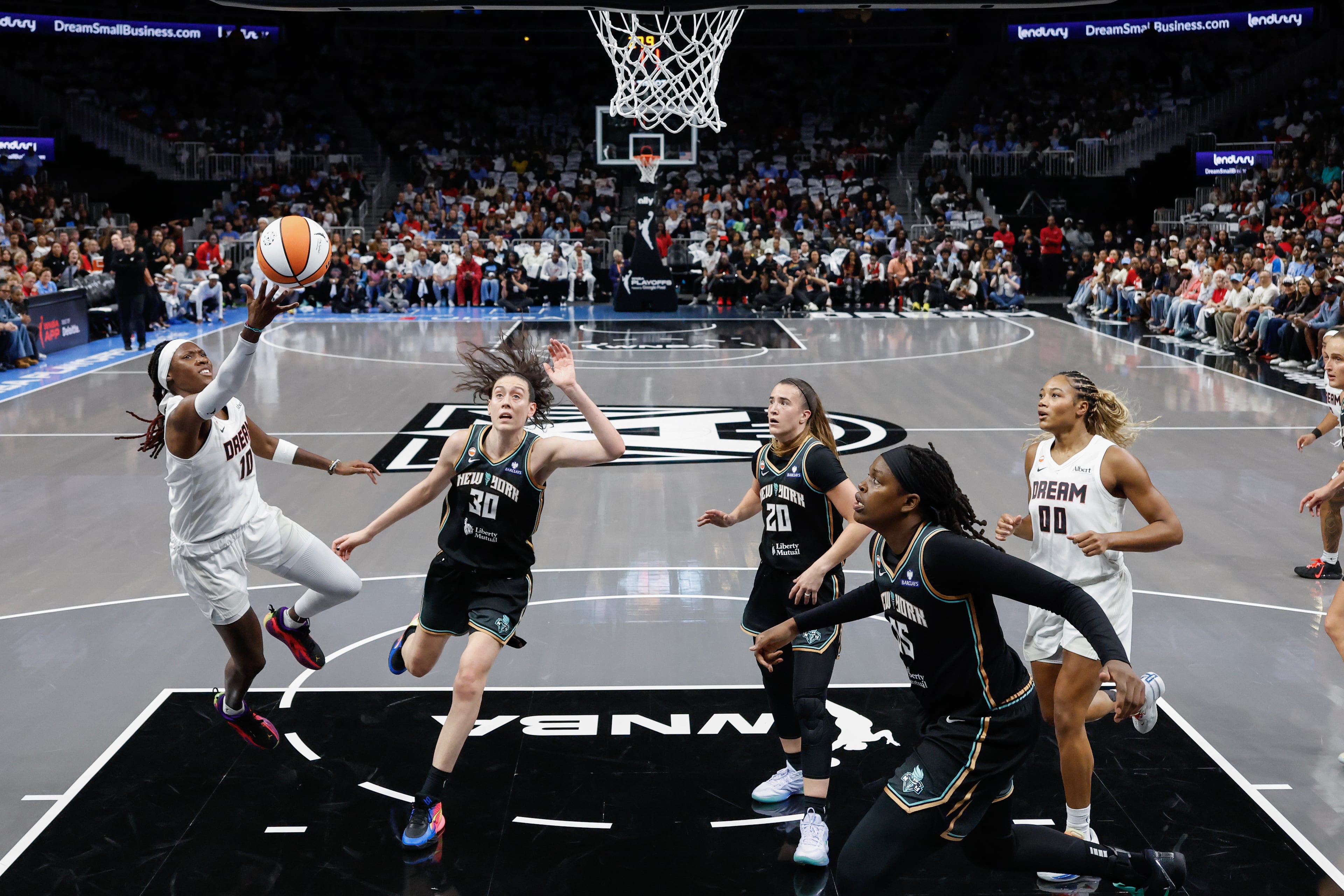 Atlanta Dream guard Rhyne Howard (10) shoots against New York Liberty forward Breanna Stewart (30) during the first half of a WNBA semifinal playoff game 1 between the Atlanta Dream and the New York Liberty, Sunday, Oct. 4, 2026, in Atlanta. (Erik S. Lesser for the AJC)