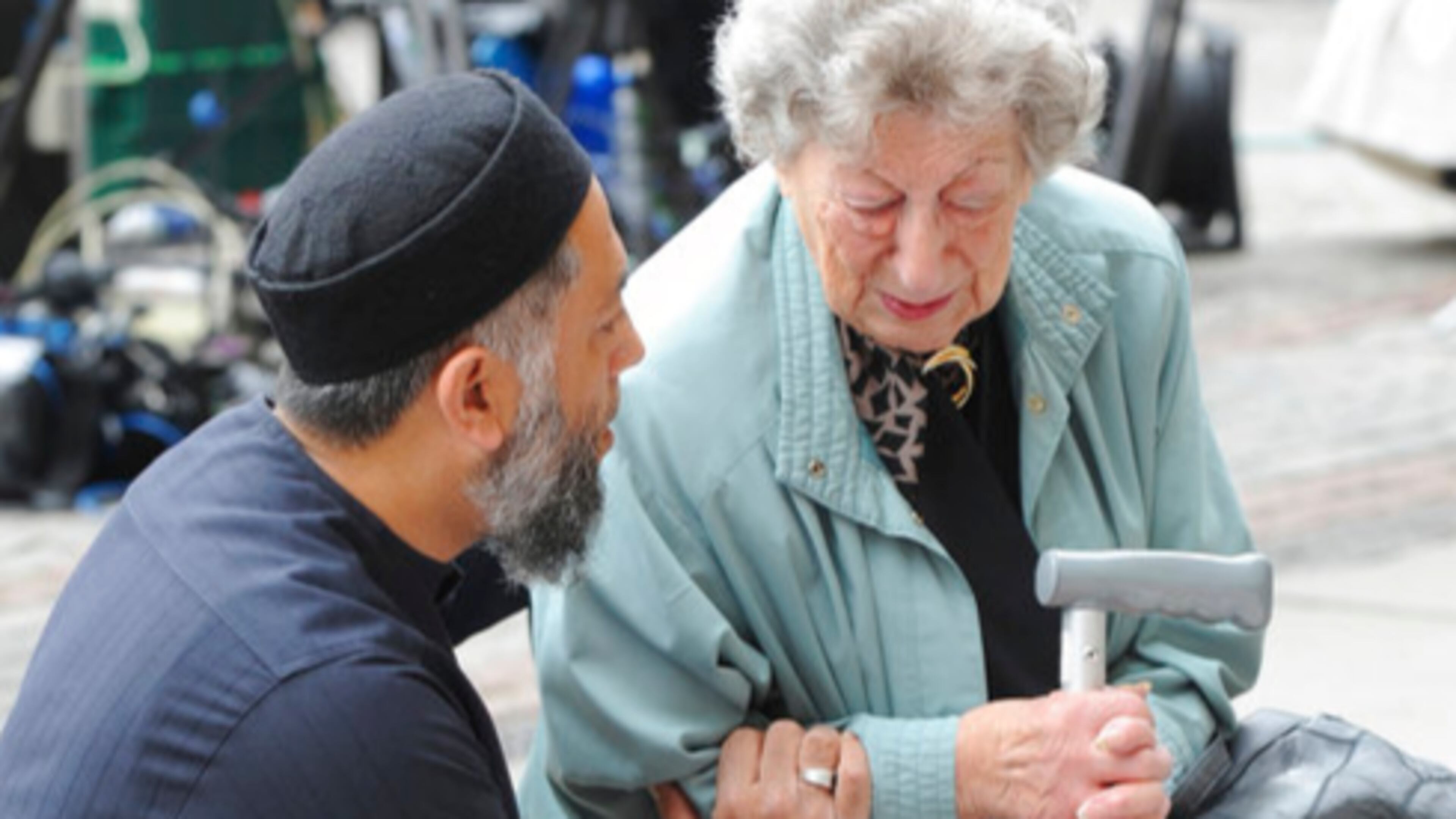 Renee Rachel Black, right, is comforted by Sadiq Patel in front of flower tributes at Albert Square central Manchester, England Wednesday May 24 2017. Police confirmed that more than 20 people were killed in an explosion following a Ariana Grande concert at the Manchester Arena late Monday evening. Britons will find armed troops at vital locations Wednesday after the official threat level was raised to its highest point. (AP Photo/Rui Vieira)