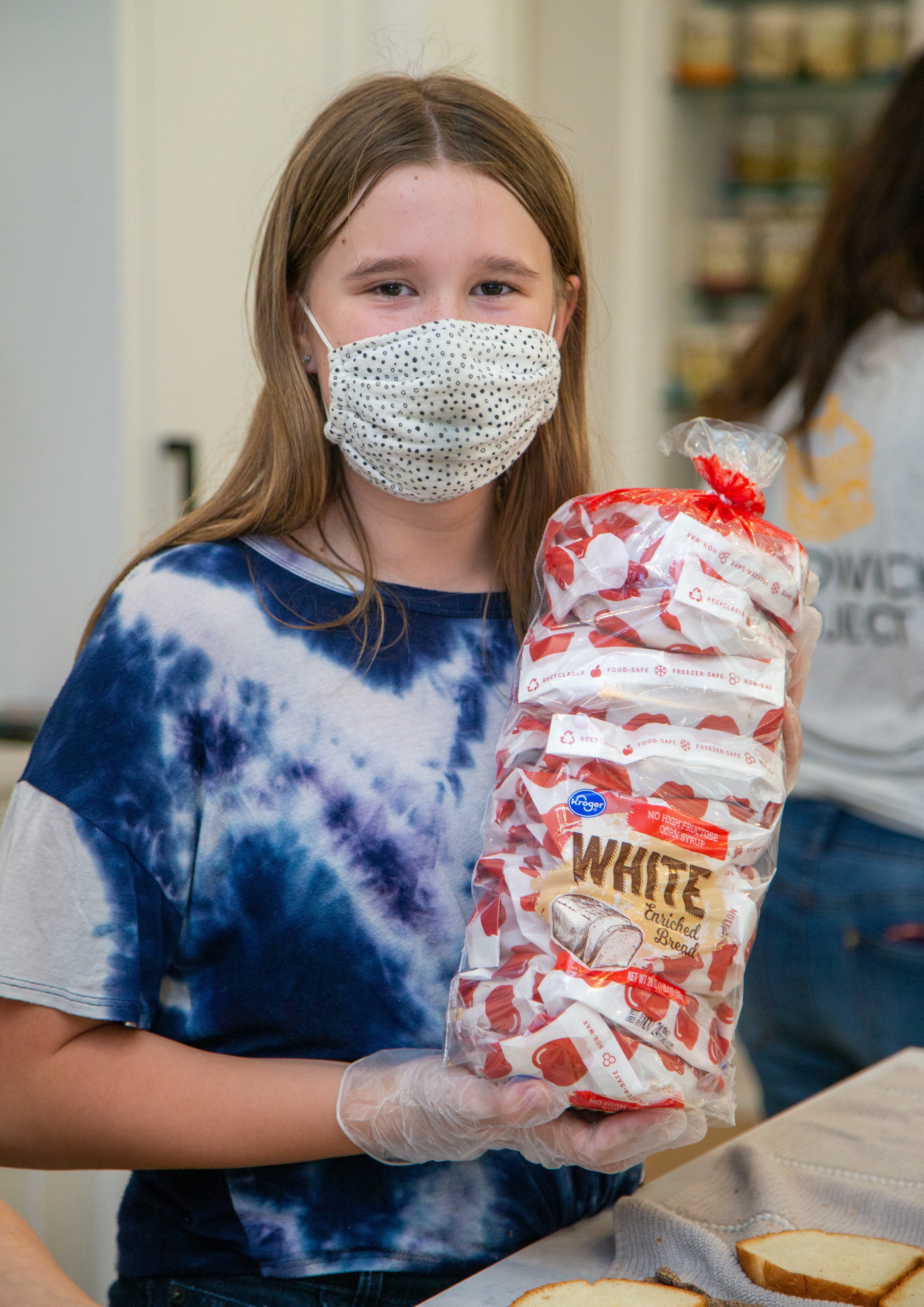 Maya Harris hold a package of sandwiches made for The Sandwich Project. Two ladies from Dunwoody started making sandwiches for the homeless during the pandemic and this project has expanded into a weekly community service project involving thousands of volunteers all over the metro area. Every week, The Sandwich Project gives away approximately 4,000 to 6,000 sandwiches, plus snacks and fruit to nonprofits for distribution. PHIL SKINNER FOR THE ATLANTA JOURNAL-CONSTITUTION.