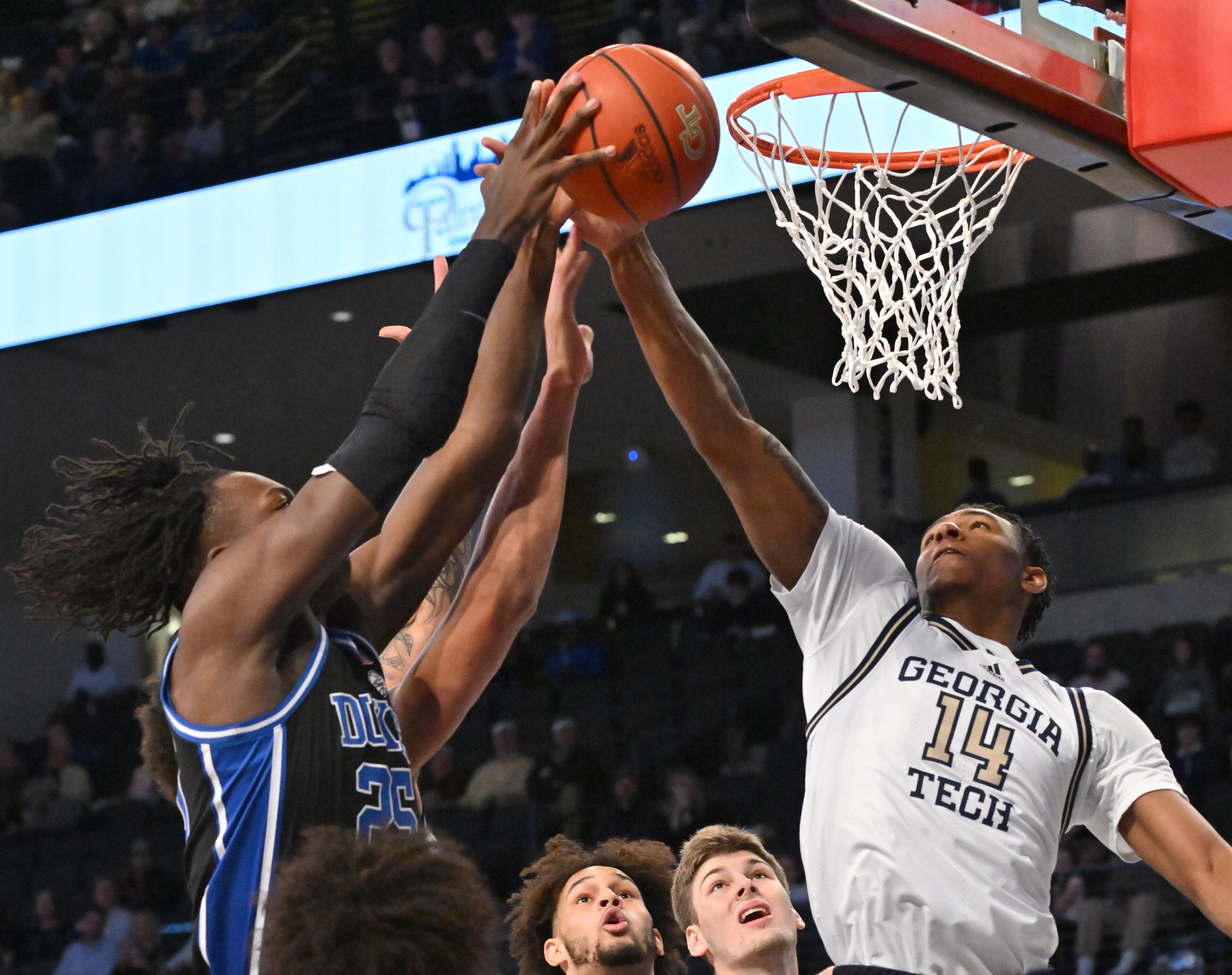 Duke’s forward Mark Mitchell (25) and Georgia Tech's forward Jalon Moore (14) fight for a rebound during the first half at Georgia Tech’s McCamish Pavilion, Saturday, Jan. 28, 2023, in Atlanta. (Hyosub Shin / Hyosub.Shin@ajc.com)