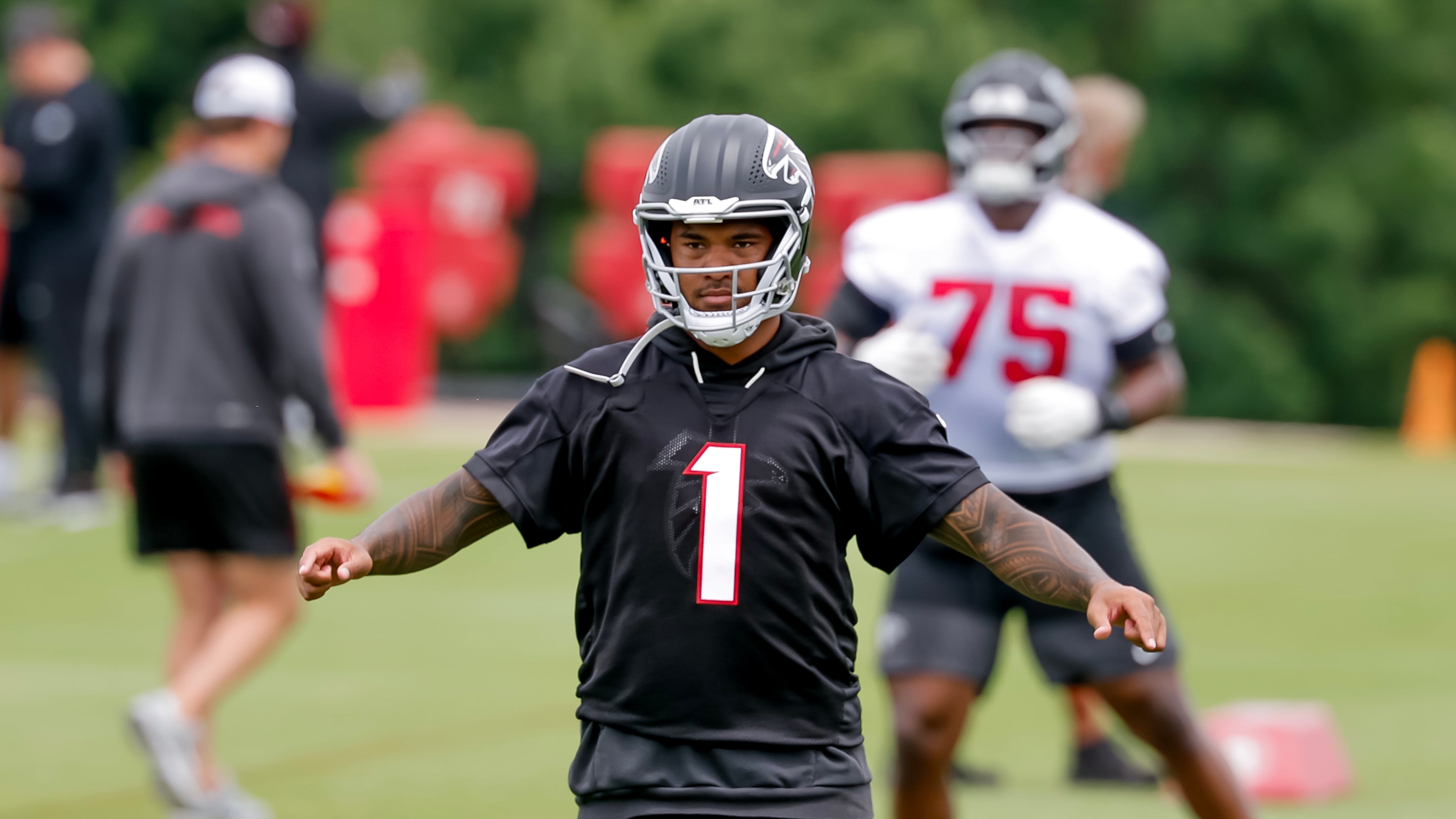 Quarterback Tua Tagovailoa is dealing with a back injury and won’t participate in the team’s first training camp practice Wednesday in Flowery Branch. (Erik S. Lesser for the AJC)