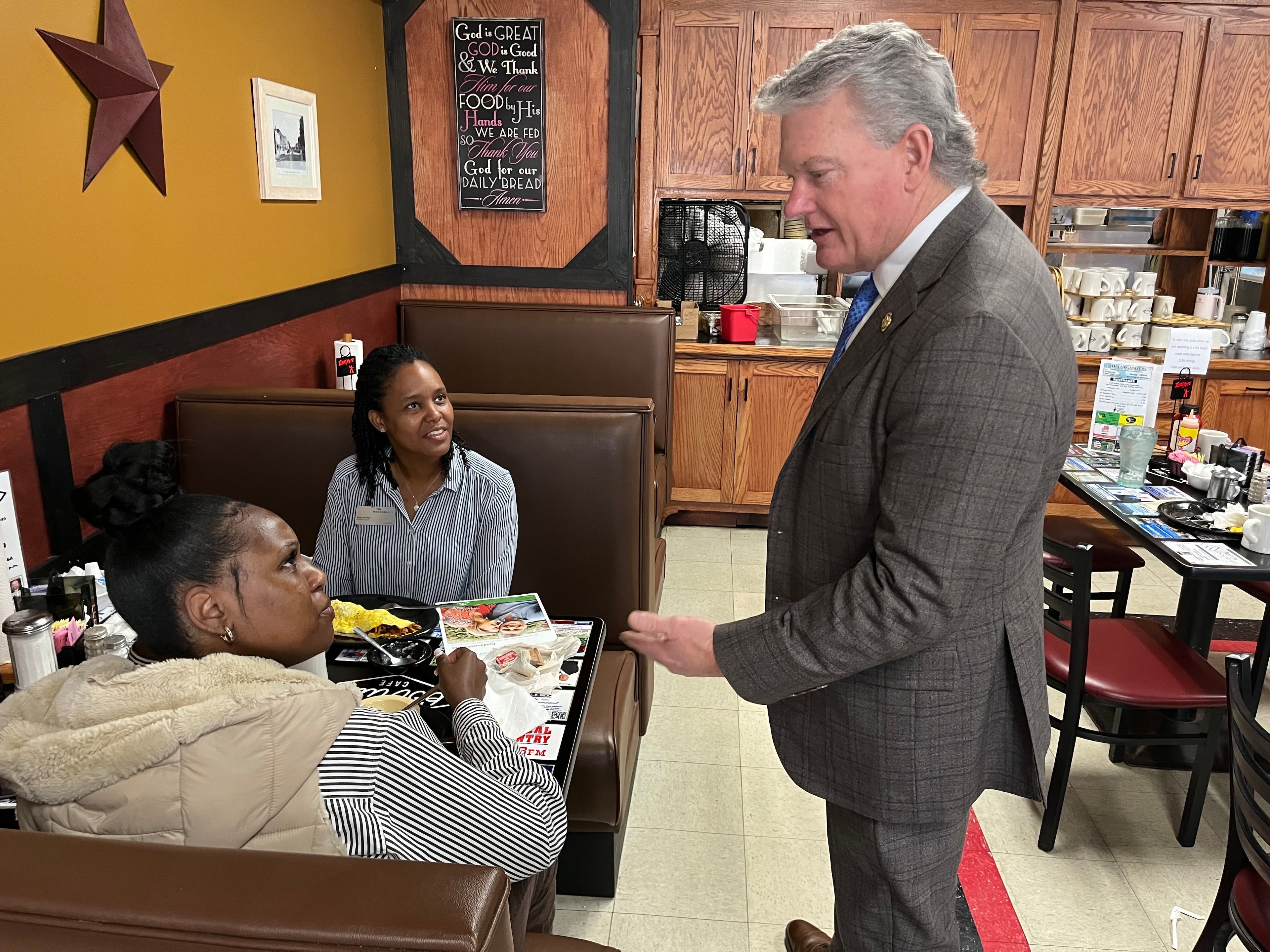 U.S. Rep. Mike Collins, R-Jackson, chatted with diners at Pot Luck Cafe in Monroe last year.