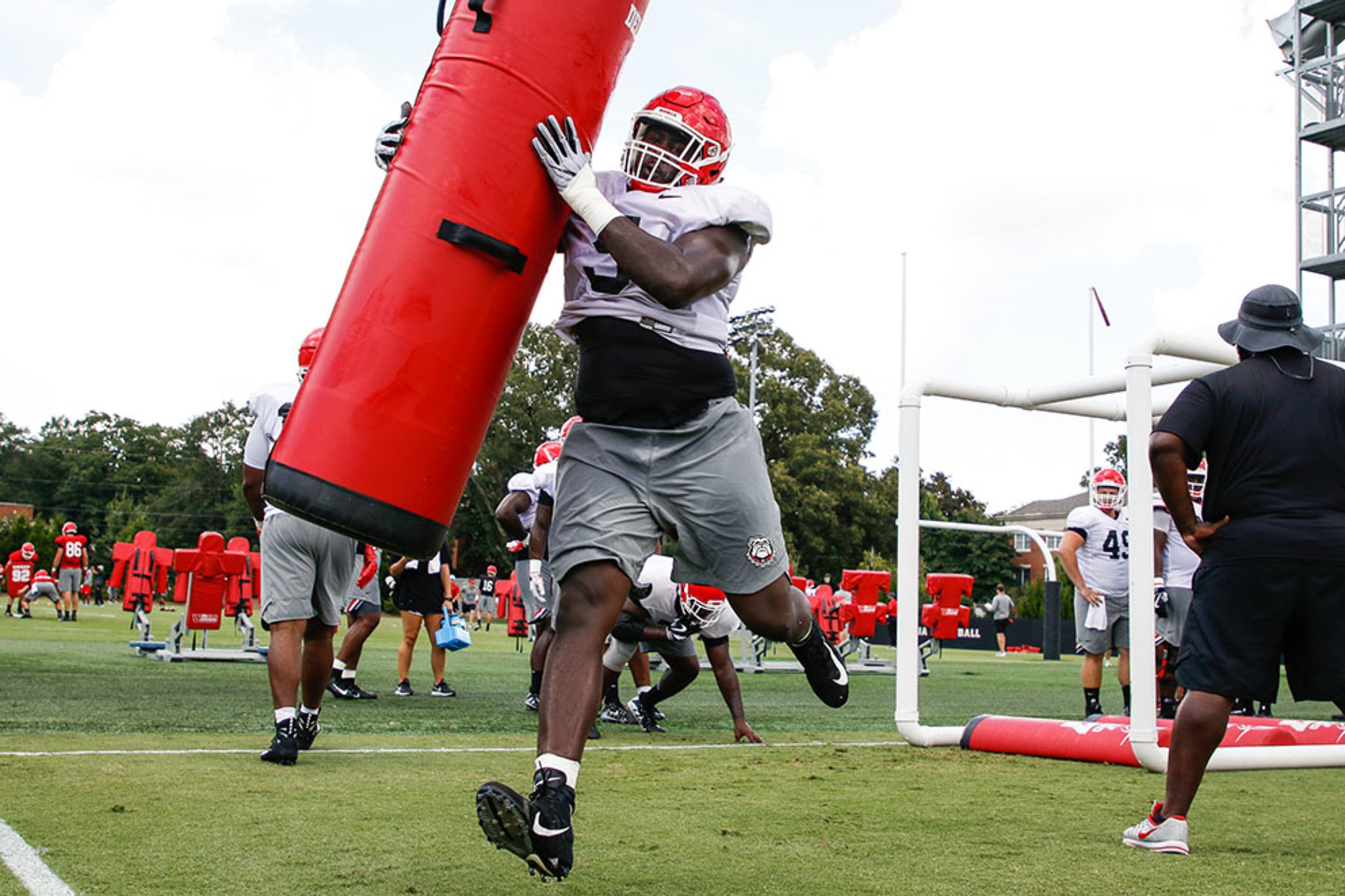 Georgia defensive lineman Julian Rochester (5) completes a drill at practice Monday, Aug. 6, 2018, at the Woodruff Practice Fields on the Georgia campus in Athens.