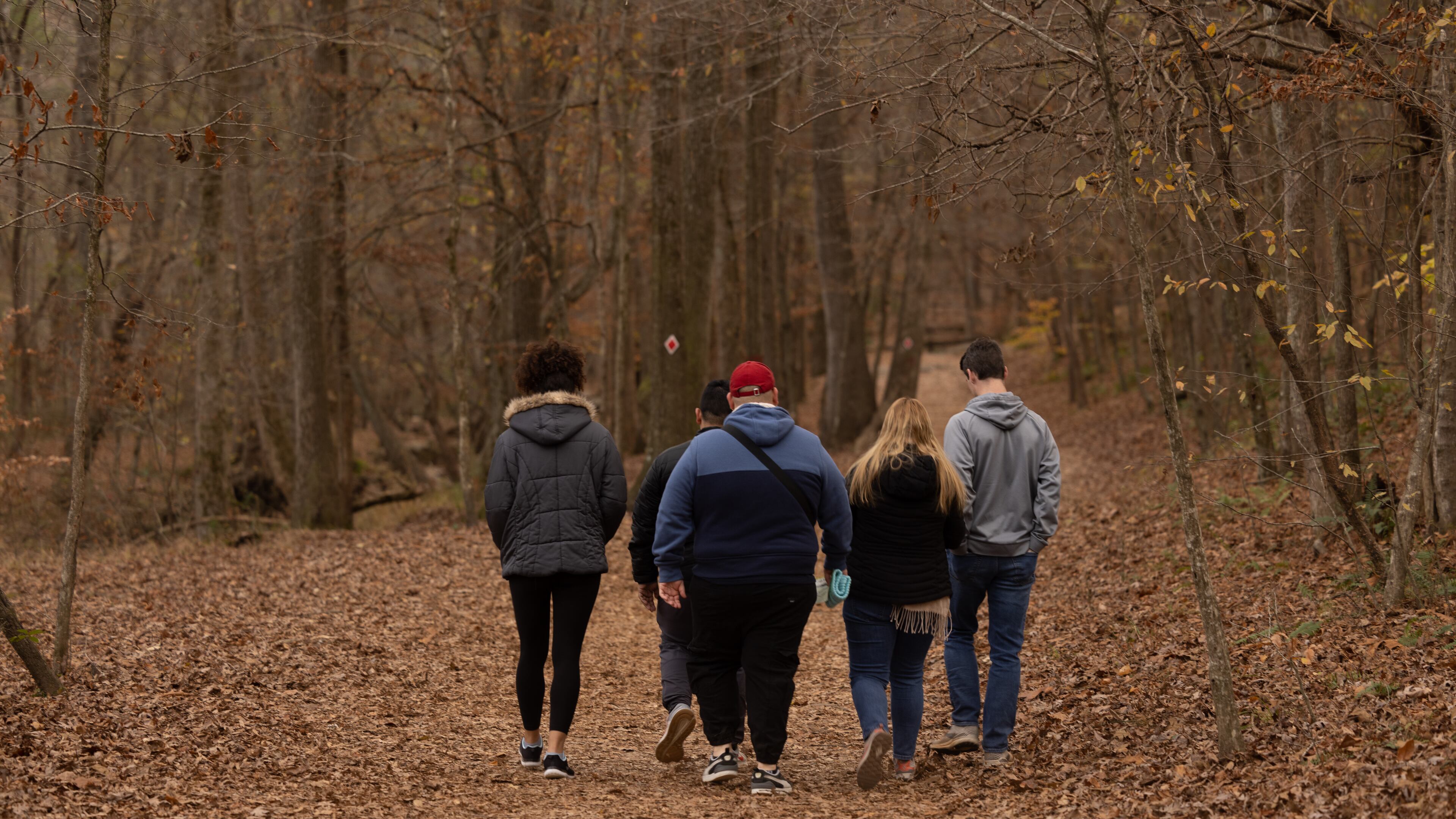 Group of people walking on trail at Sweetwater Creek State Park on November 20, 2022