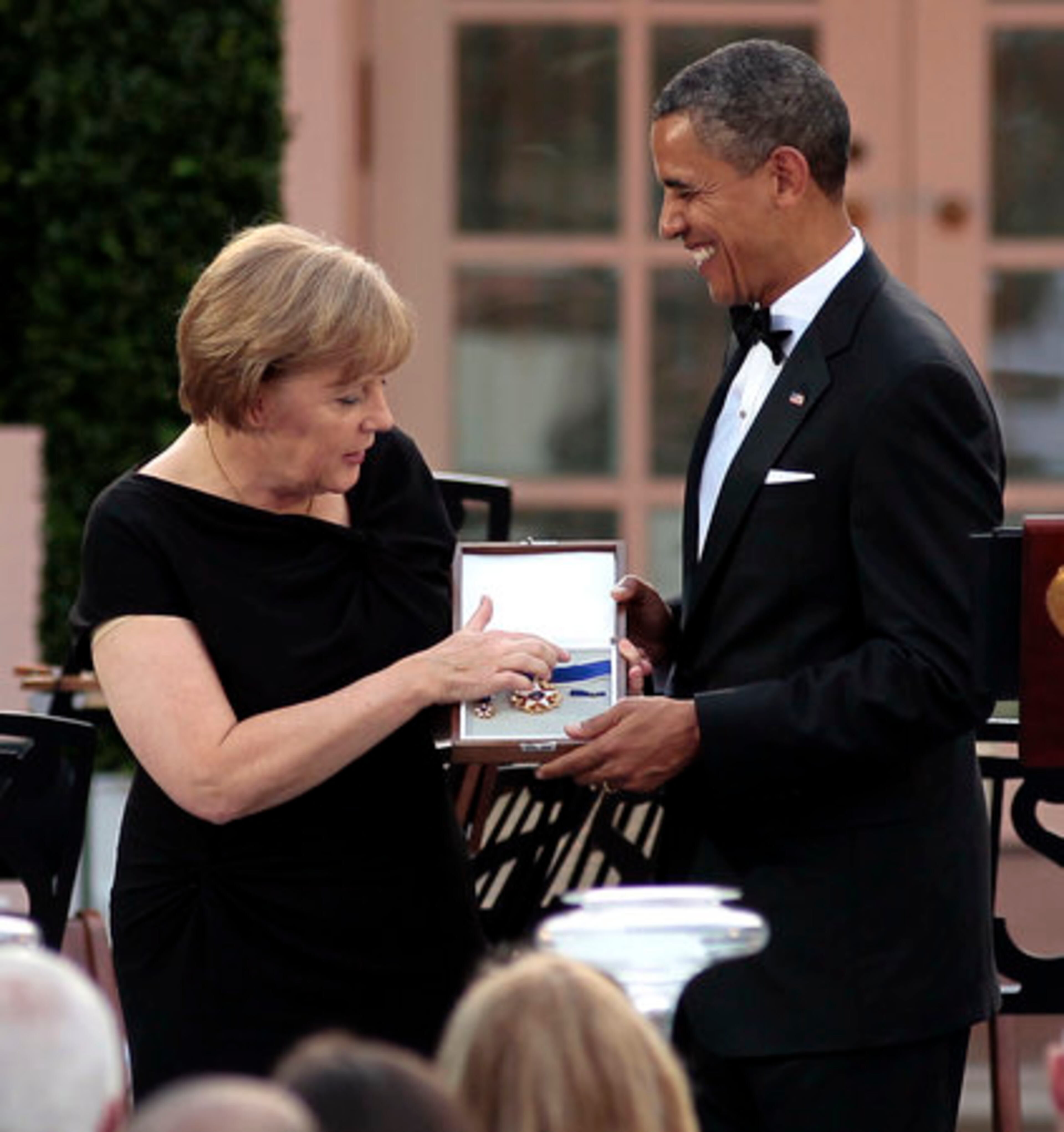 German Chancellor Angela Merkel receives the Medal of Freedom from President Barack Obama.