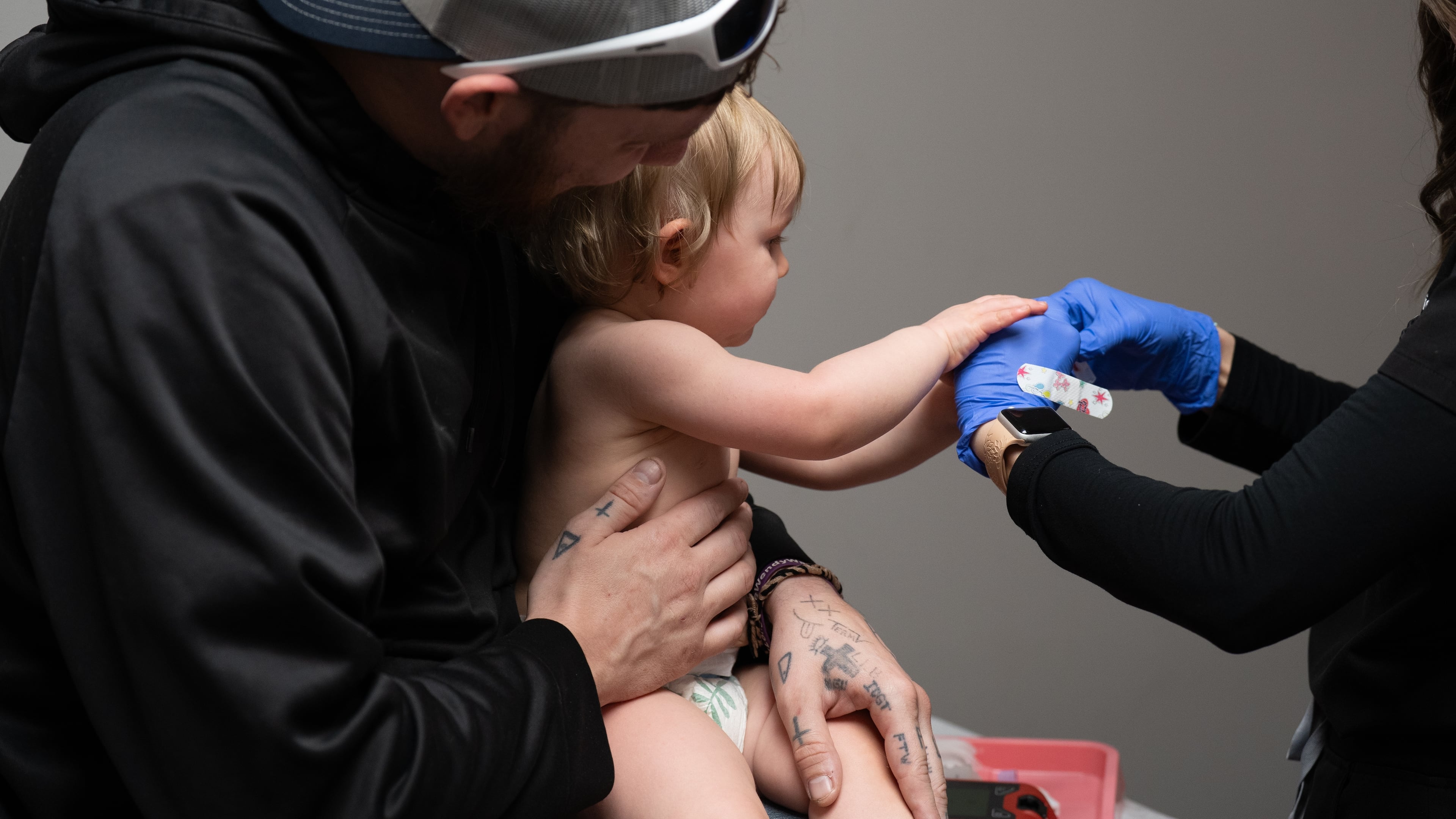 Daren Chandler's 12-month-old daughter has blood drawn before receiving a measles shot at Tiger Pediatrics in Easley, South Carolina on March 17, 2026. (Mary Conlon/AP)