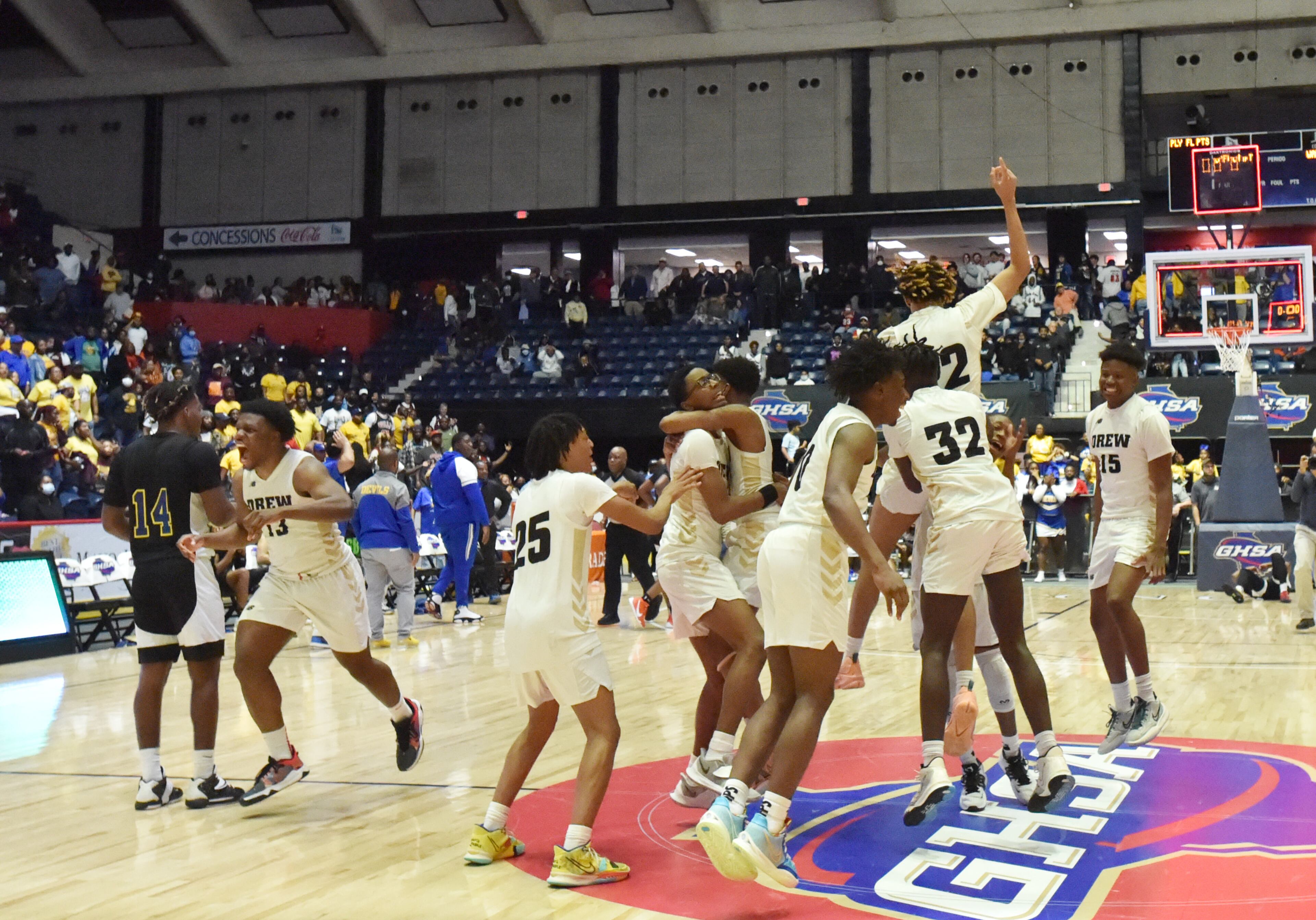 State champs: Drew Charter players celebrate after their victory in the Class A Public boys state championship game Wednesday in Macon. Drew Charter rallied from a four-point deficit in the final 23.6 seconds to defeat Warren County 51-50. (Hyosub Shin/hshin@ajc.com)