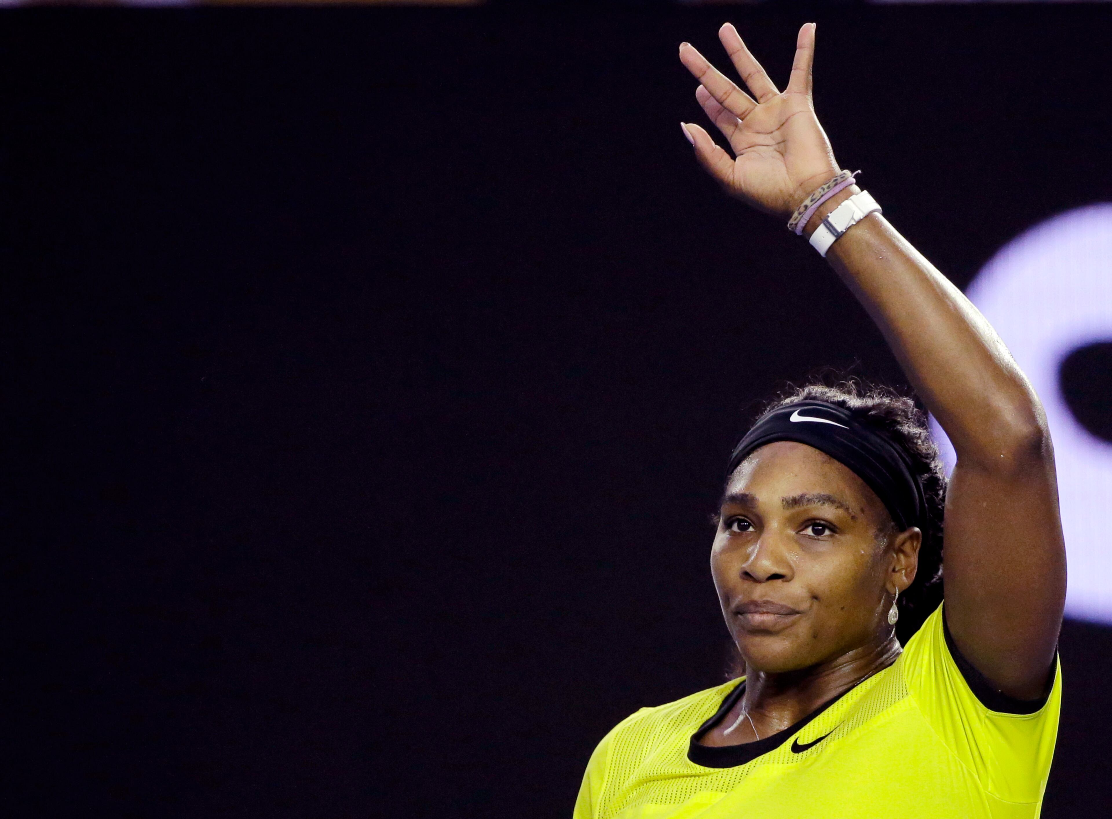 Serena Williams of the United States waves after defeating Daria Kasatkina of Russia in their third round match at the Australian Open tennis championships in Melbourne, Australia, Friday, Jan. 22, 2016.(AP Photo/Aaron Favila)