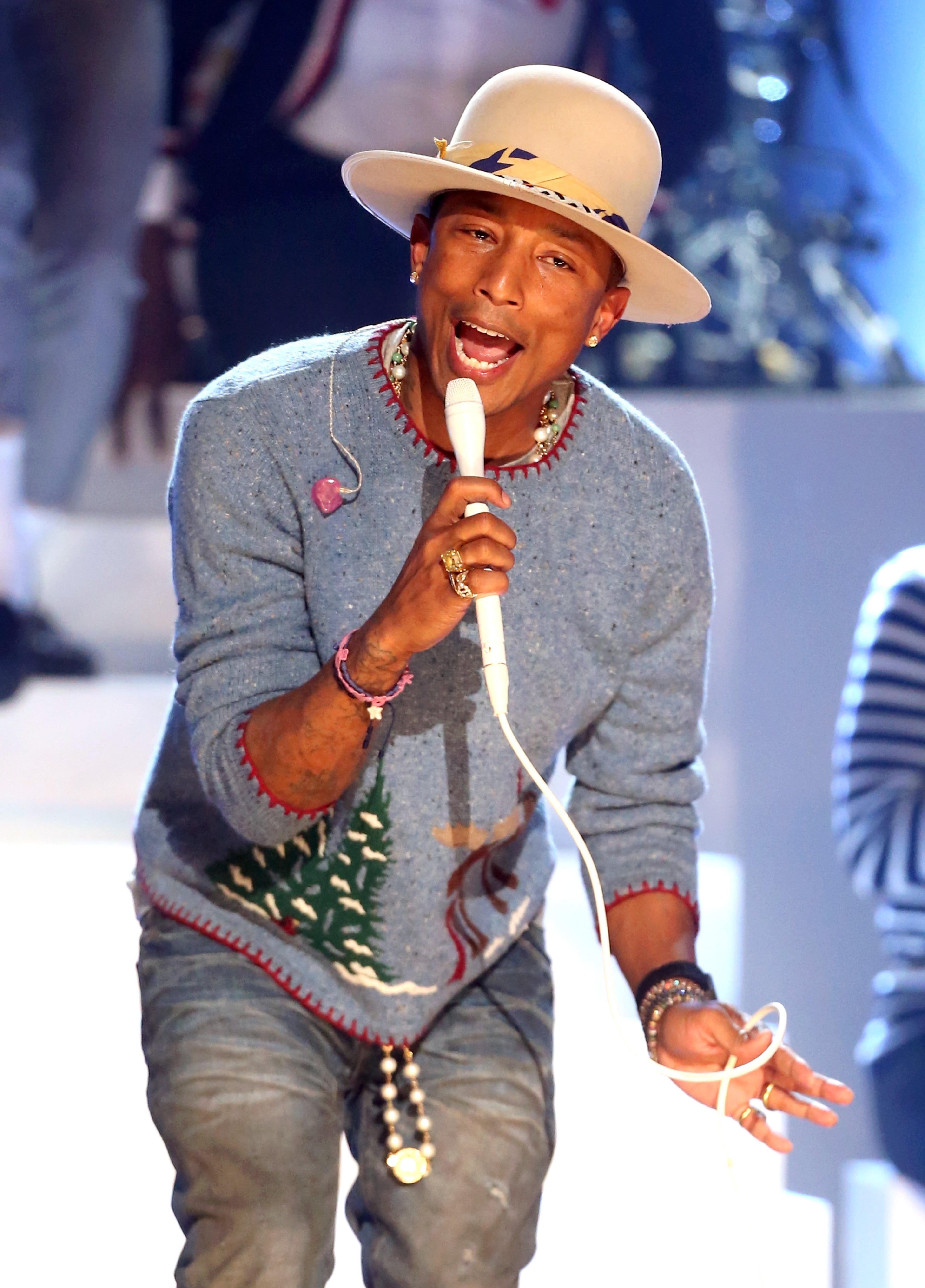 LOS ANGELES, CA - NOVEMBER 18: Musician Pharrell Williams performs onstage during A VERY GRAMMY CHRISTMAS at The Shrine Auditorium on November 18, 2014 in Los Angeles, California. (Photo by Frederick M. Brown/Getty Images)