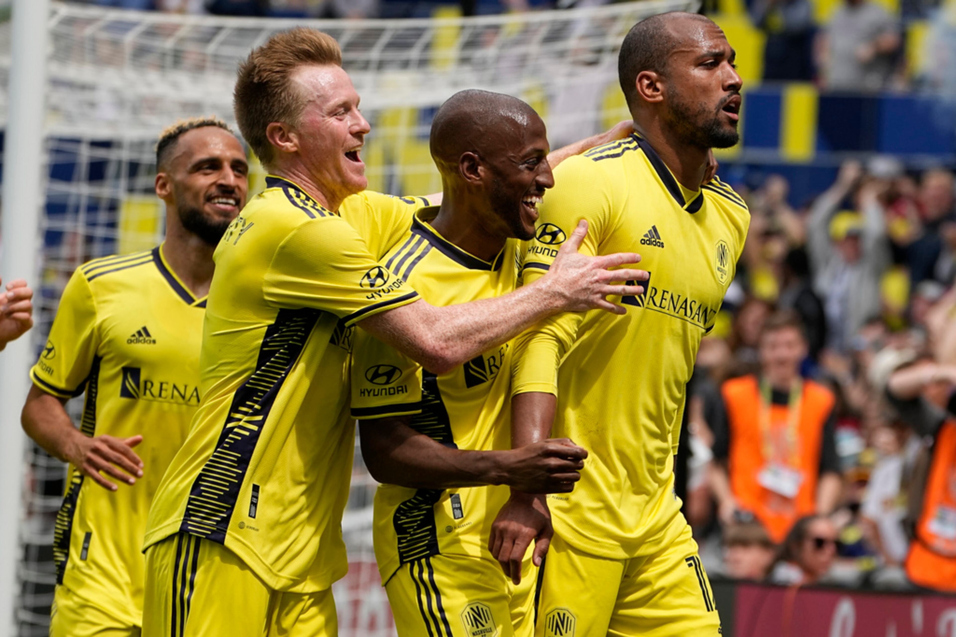 Nashville SC midfielder Dax McCarty, second from left, and midfielder Fafà Picault, center, congratulate forward Teal Bunbury after his goal against Atlanta United during the second half of an MLS soccer match on Saturday, April 29, 2023, in Nashville, Tenn. (AP Photo/George Walker IV)