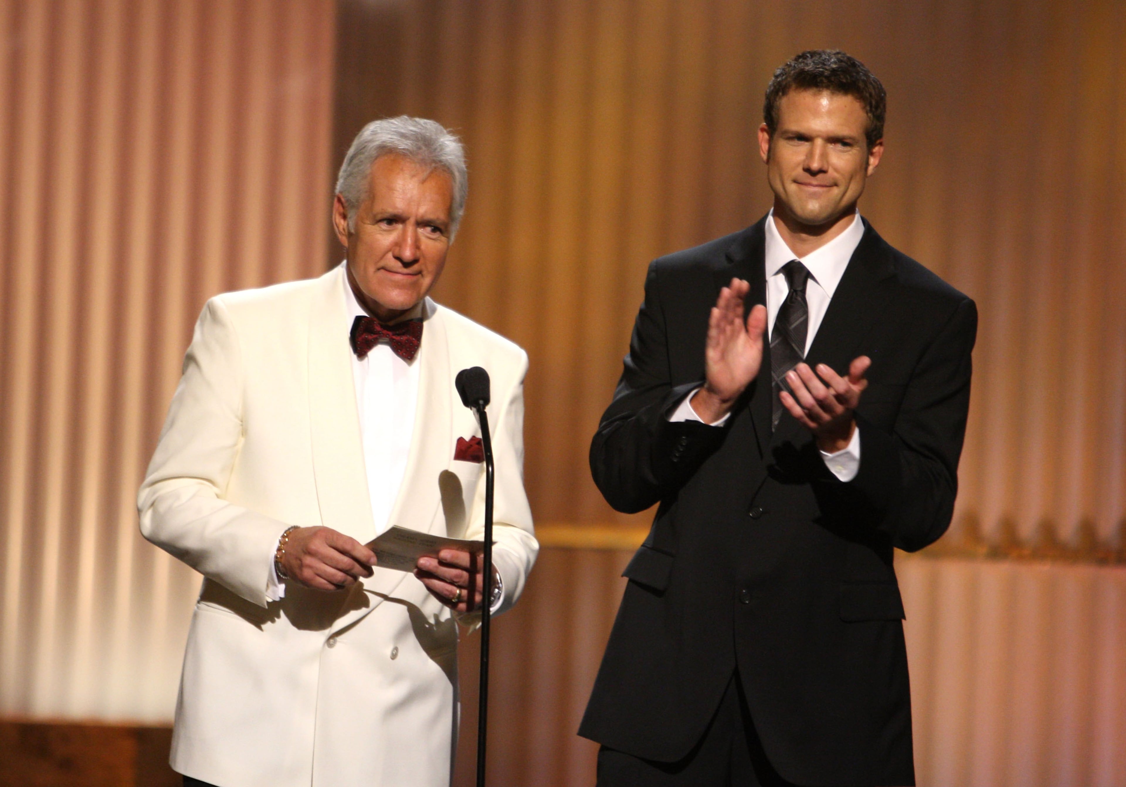 TV personalizes Alex Trebek (L) and Travis Storkspeak during the 36th Annual Daytime Emmy Awards at The Orpheum Theatre on August 30, 2009 in Los Angeles, California.