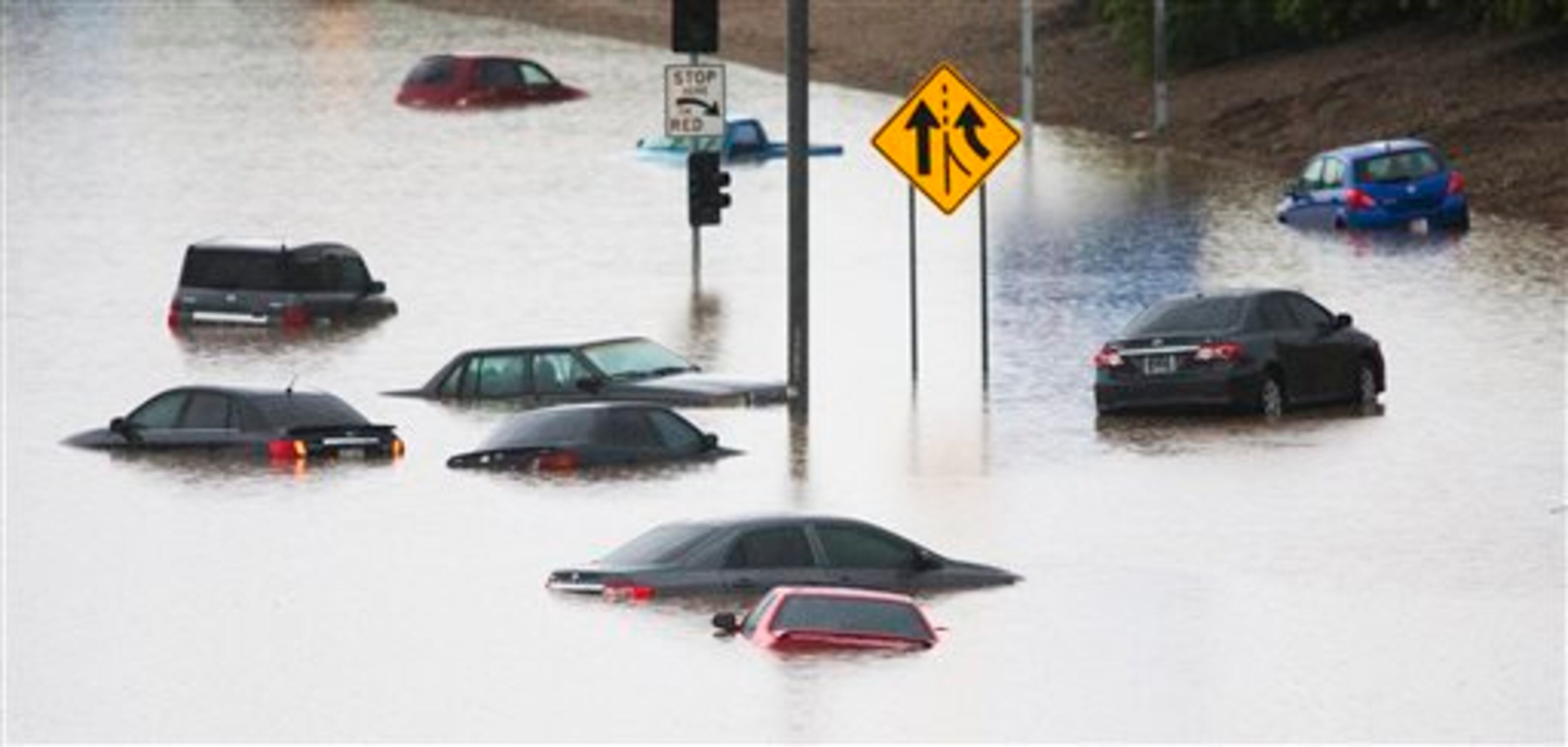 Cars are underwater at 43rd Ave. and I-10 in the westbound lanes in Phoenix, Monday, Sept. 8, 2014, after record-setting rainfall caused massive flooding throughout the Valley. Heavy storms pounded the Phoenix area early Monday, flooding major freeways, prompting several water rescues and setting an all-time single-day record for rainfall in the desert city. (AP Photo/The Arizona Republic, Tom Tingle) MARICOPA COUNTY OUT - NO MAGS- NO SALES - MANDATORY CREDIT