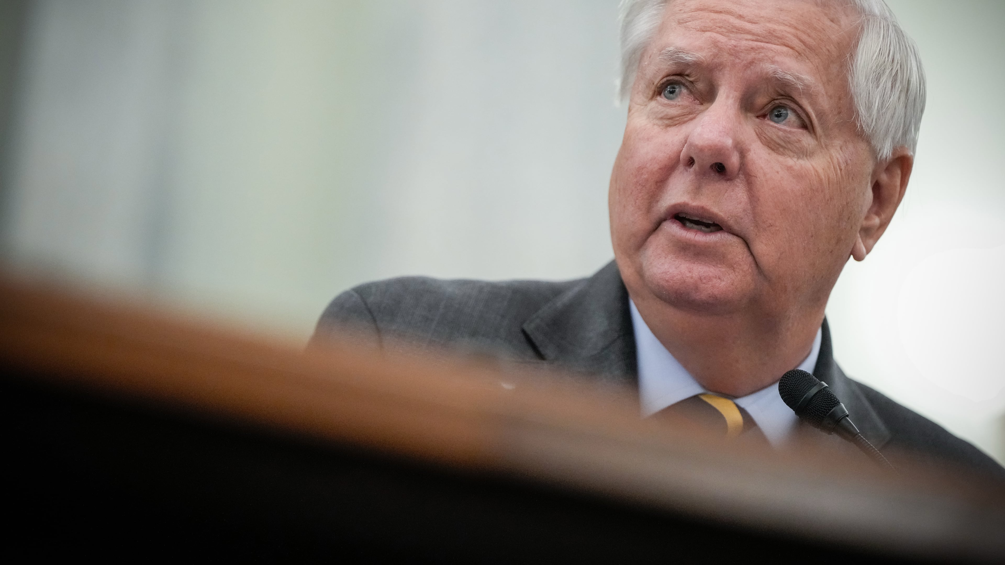 FILE - Sen. Lindsey Graham, R-S.C., introduces Adm. Kevin Lunday, acting commandant of the U.S. Coast Guard, during a Senate Commerce, Science and Transportation Committee hearing on the nomination Lunday for Commandant of the Coast Guard, Nov. 19, 2025, on Capitol Hill in Washington. (AP Photo/Julia Demaree Nikhinson, File)