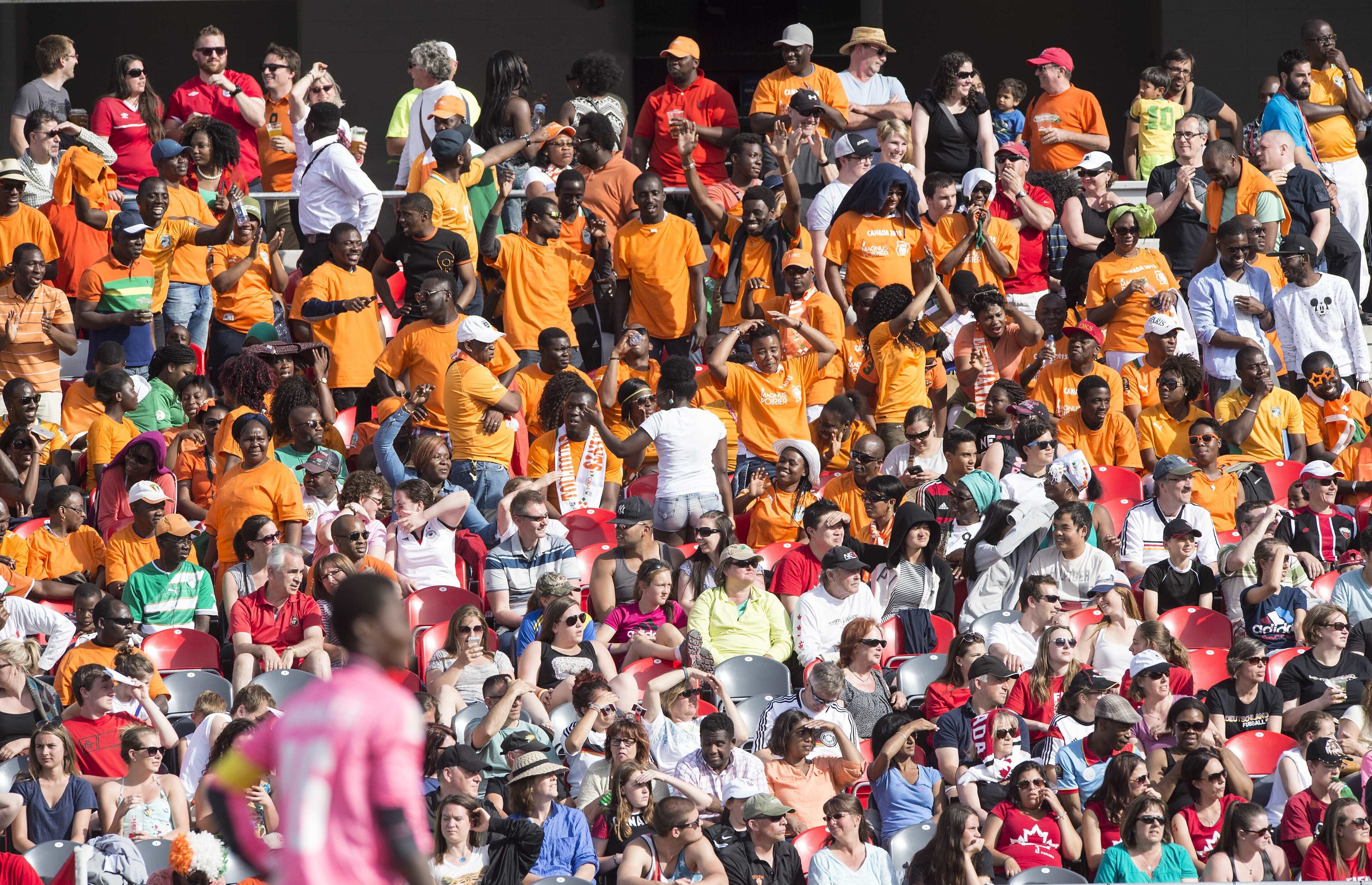 Ivory Coast fans watch their team play Germany during a Group B match at the 2015 FIFA Women's World Cup at Landsdowne Stadium in Ottawa on June 7, 2015. AFP PHOTO/NICHOLAS KAMM (Photo credit should read NICHOLAS KAMM/AFP/Getty Images)