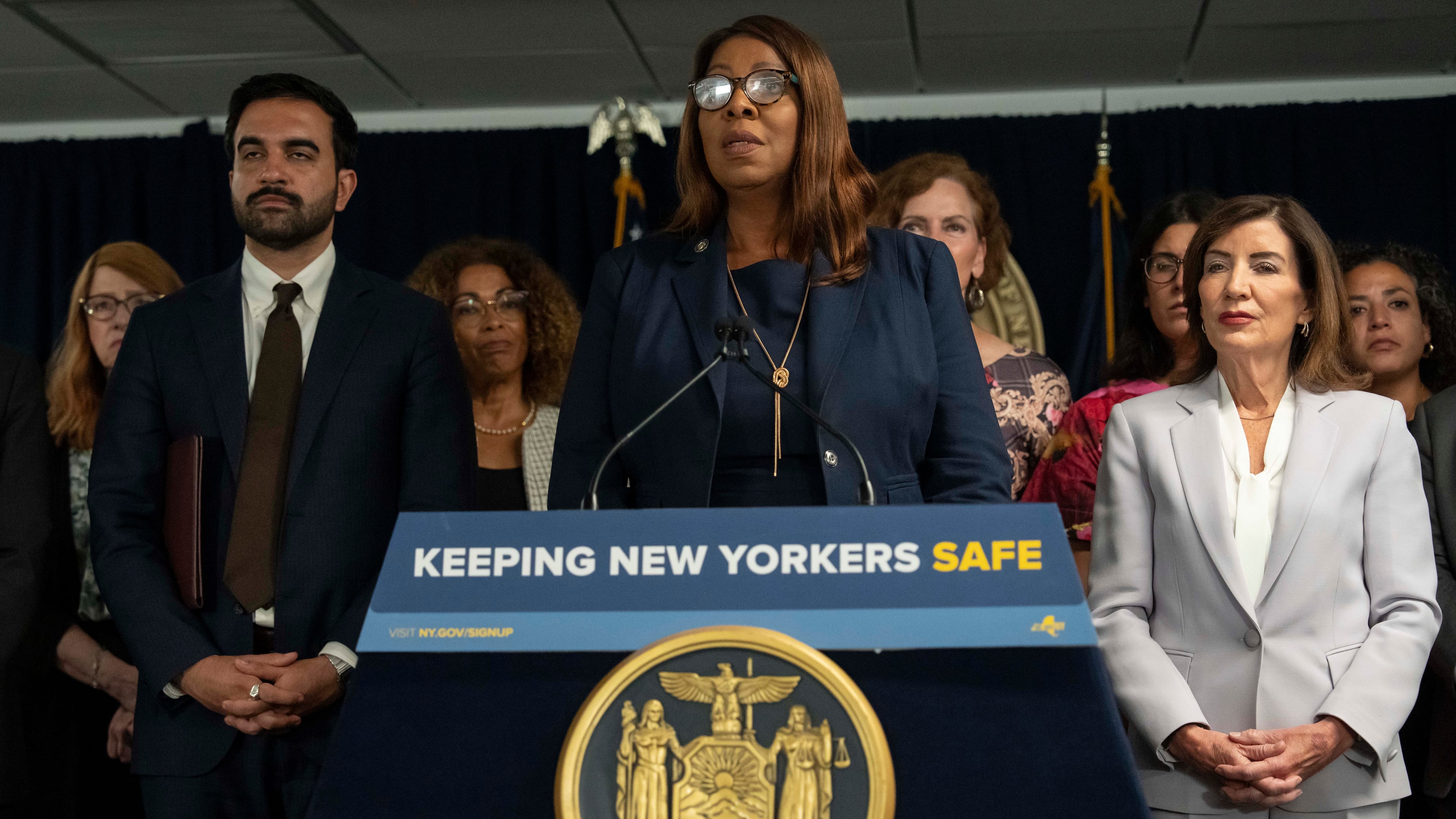 New York Attorney General Letitia James, flanked by New York Mayor Zohran Mamdani, left, and New York Governor Kathy Hochul, takes part in a press conference to announce action against ICE overreach in New York, Wednesday, Aug. 12, 2026. (AP Photo/Yuki Iwamura)