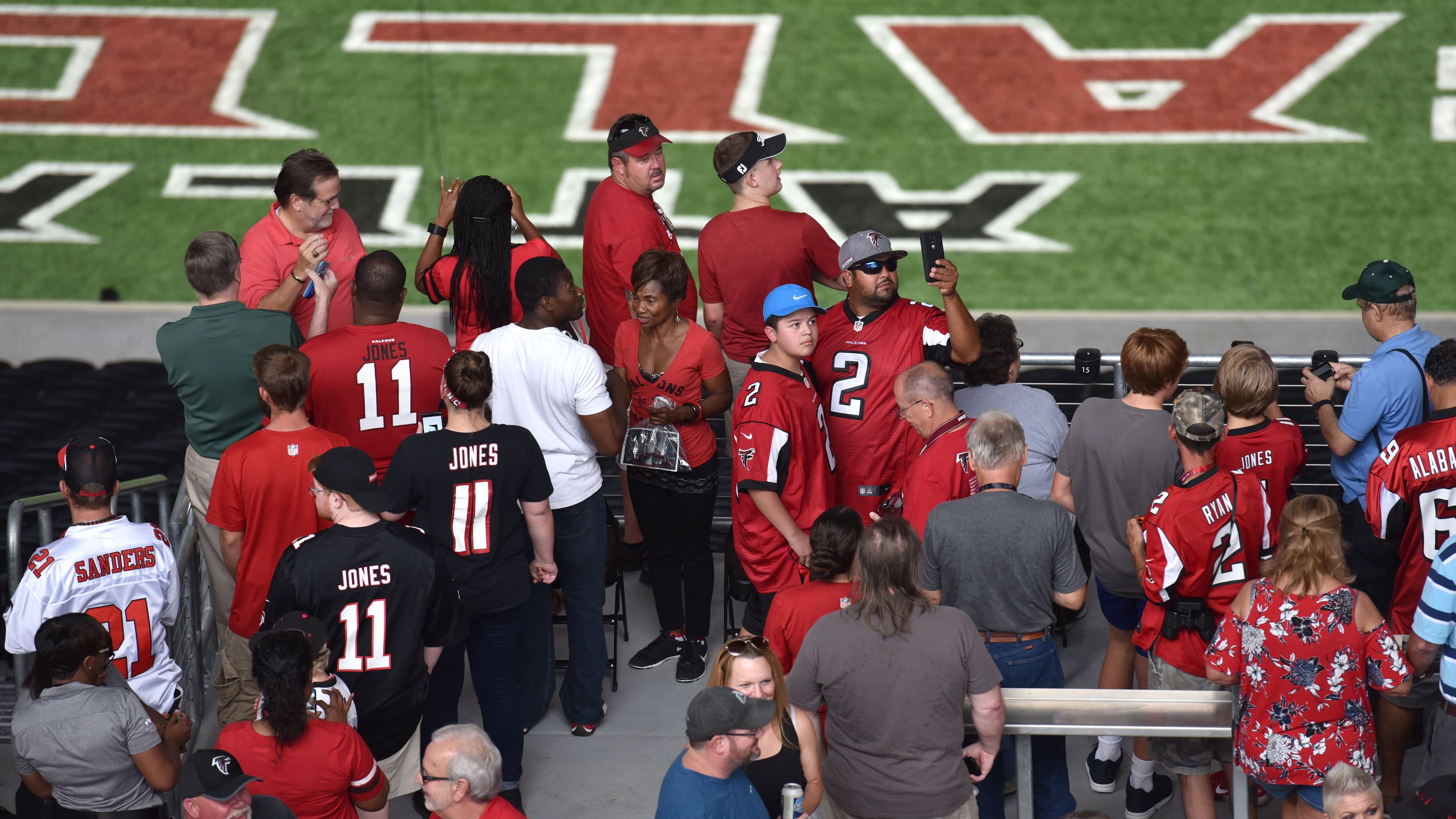 August 26, 2017 Atlanta - Atlanta Falcons fans walk through inside new Mercedes-Benz Stadium before an exhibition game against the Arizona Cardinals on Saturday, August 26, 2017. HYOSUB SHIN / HSHIN@AJC.COM
