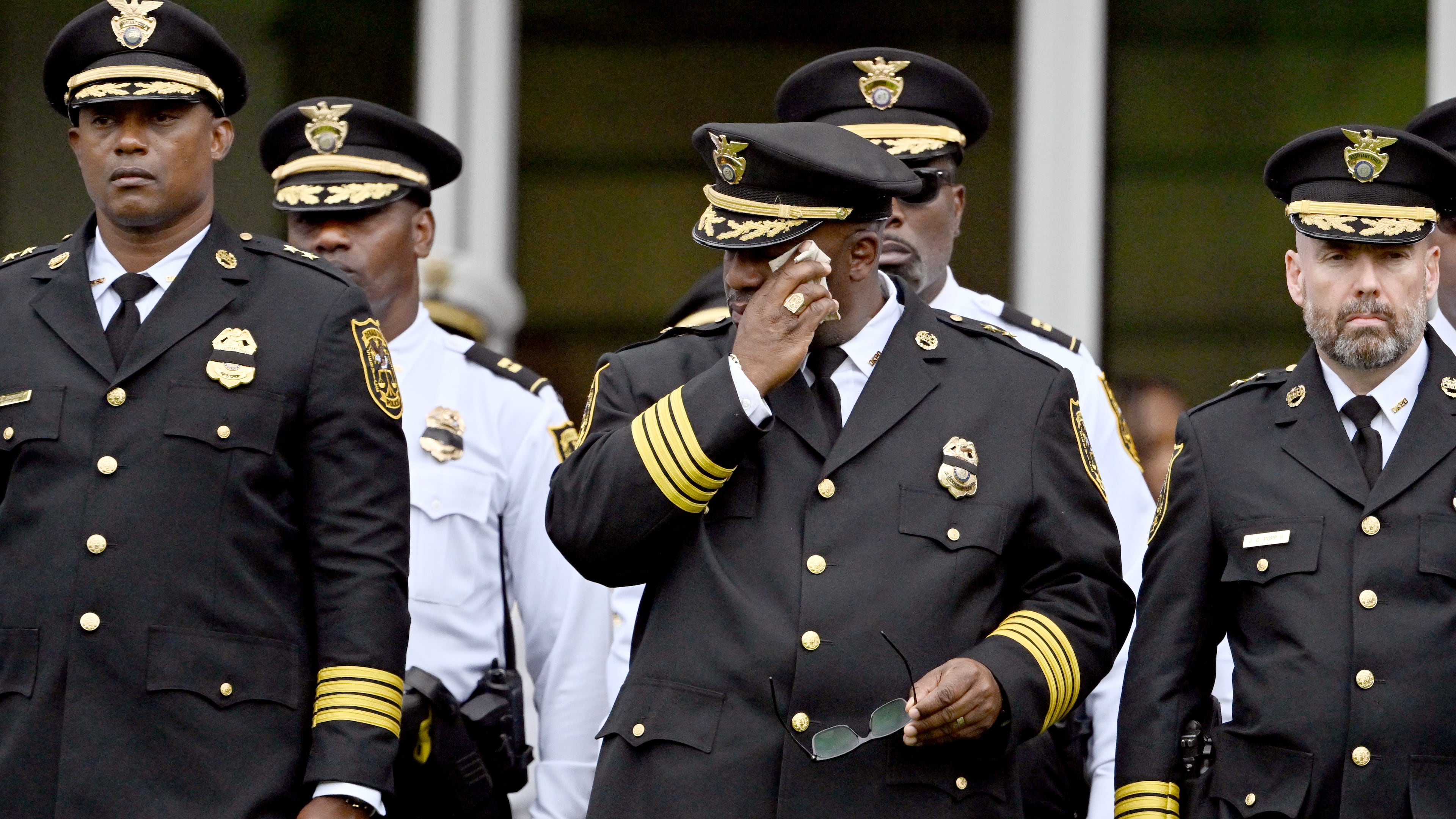 Members of various law enforcement agencies react during the Final Honors following the memorial service for DeKalb County police officer David Rose, who was killed while responding to the Aug. 8, 2025, shooting at the CDC, outside the First Baptist Church Atlanta, Friday, Aug. 22, 2025, in Atlanta. (Hyosub Shin/AJC)