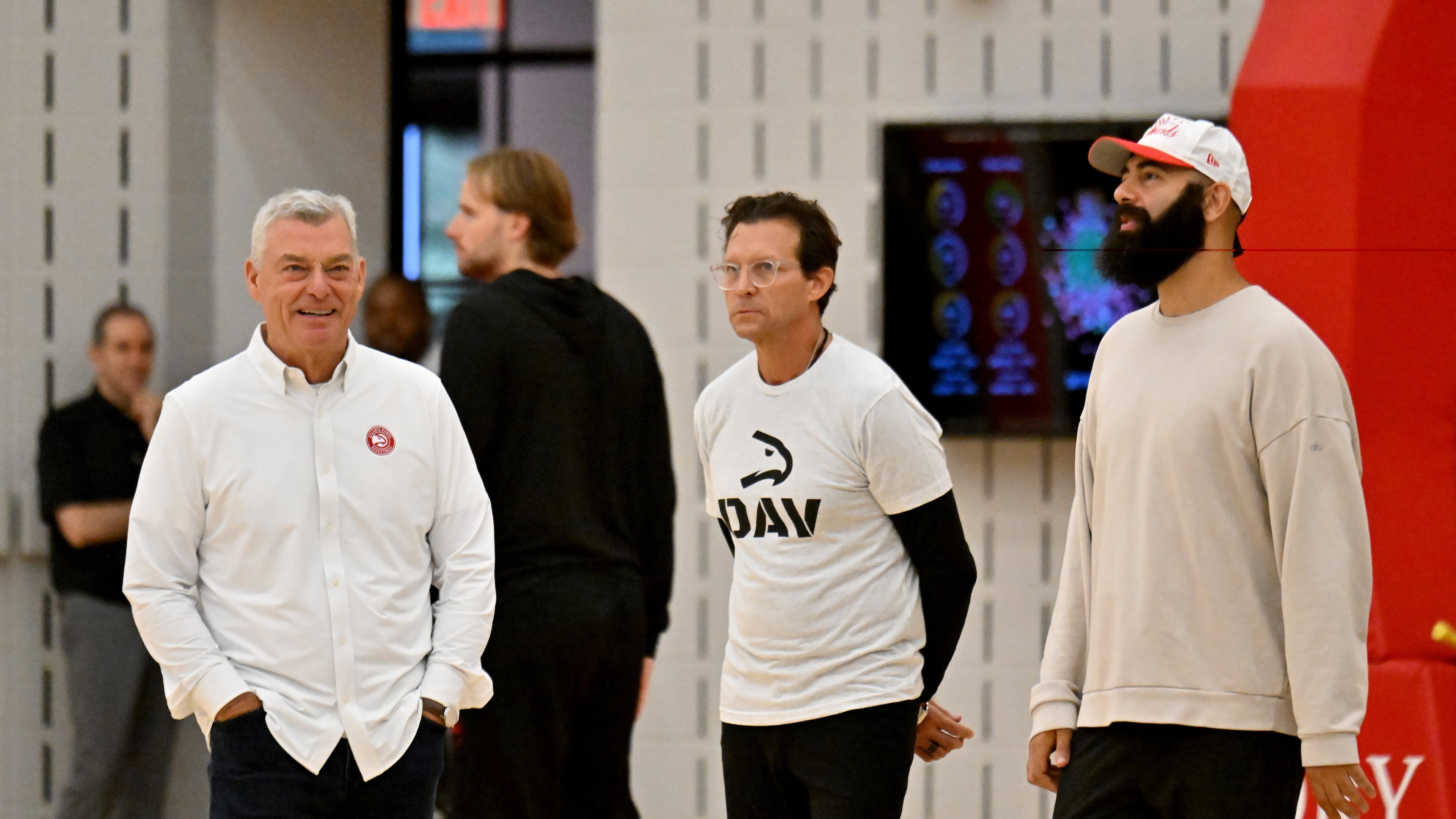 From left, principal owner Tony Ressler, coach Quin Snyder and general manager Onsi Saleh confer during the first day of Atlanta Hawks training camp at the team’s practice facility at the Emory Sports Medicine Complex, Tuesday, Sept. 30, 2025, in Atlanta. (Hyosub Shin/AJC)