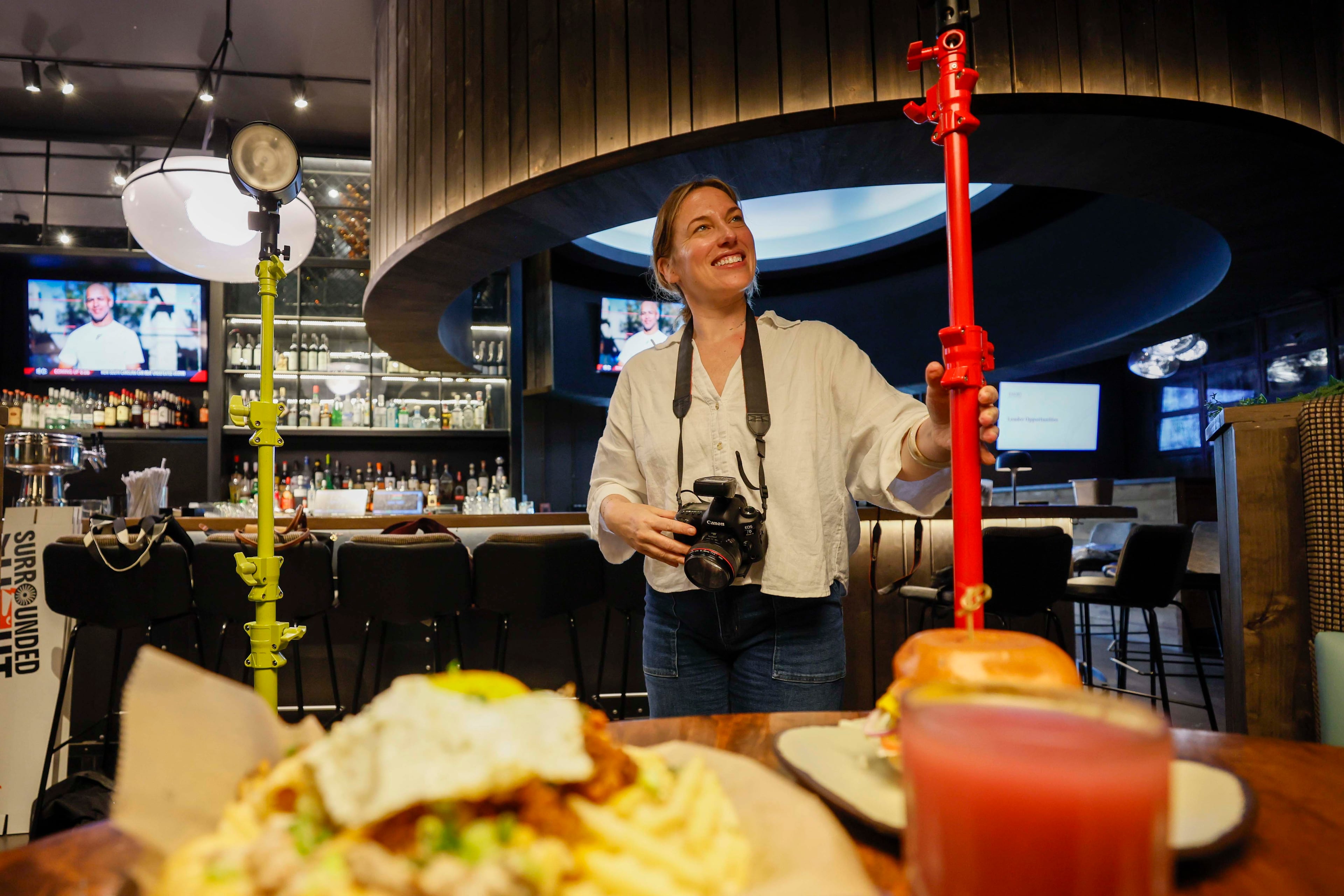 Harris sees her new company, Surrounded by Light, as a way to reframe photoshoots as more of an experience. (Miguel Martinez/AJC)