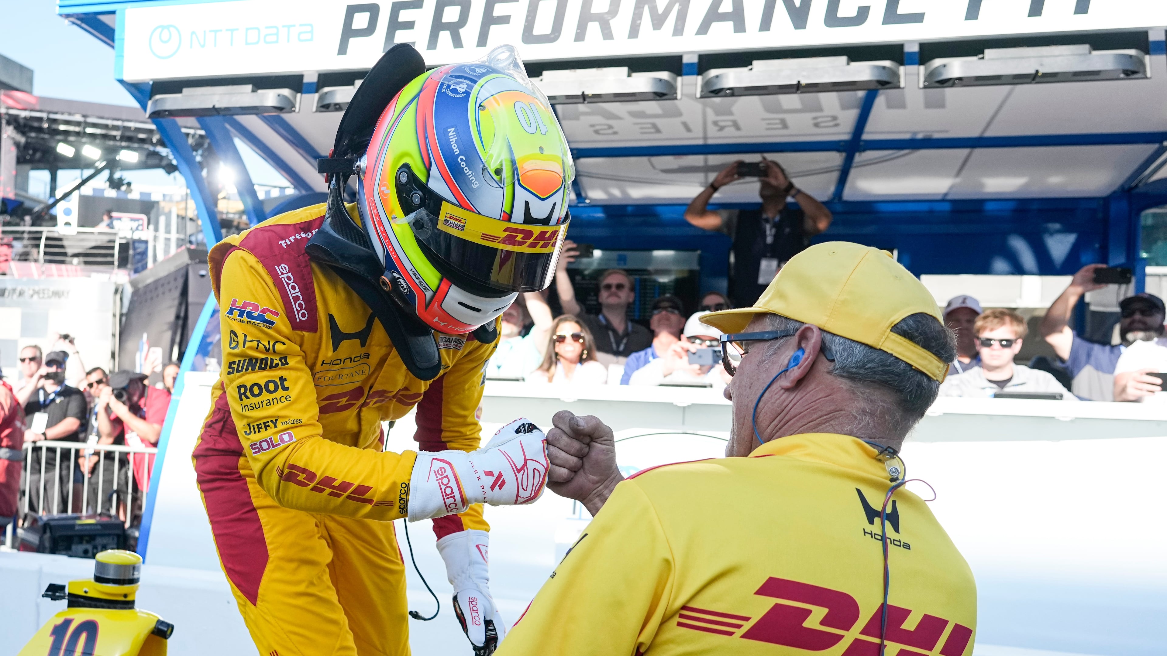 Alex Palou, of Spain, celebrates with a member of his crew during qualifications for the Indianapolis 500 auto race at the in Indianapolis, Sunday, May 17, 2026. (AP Photo/Michael Conroy)