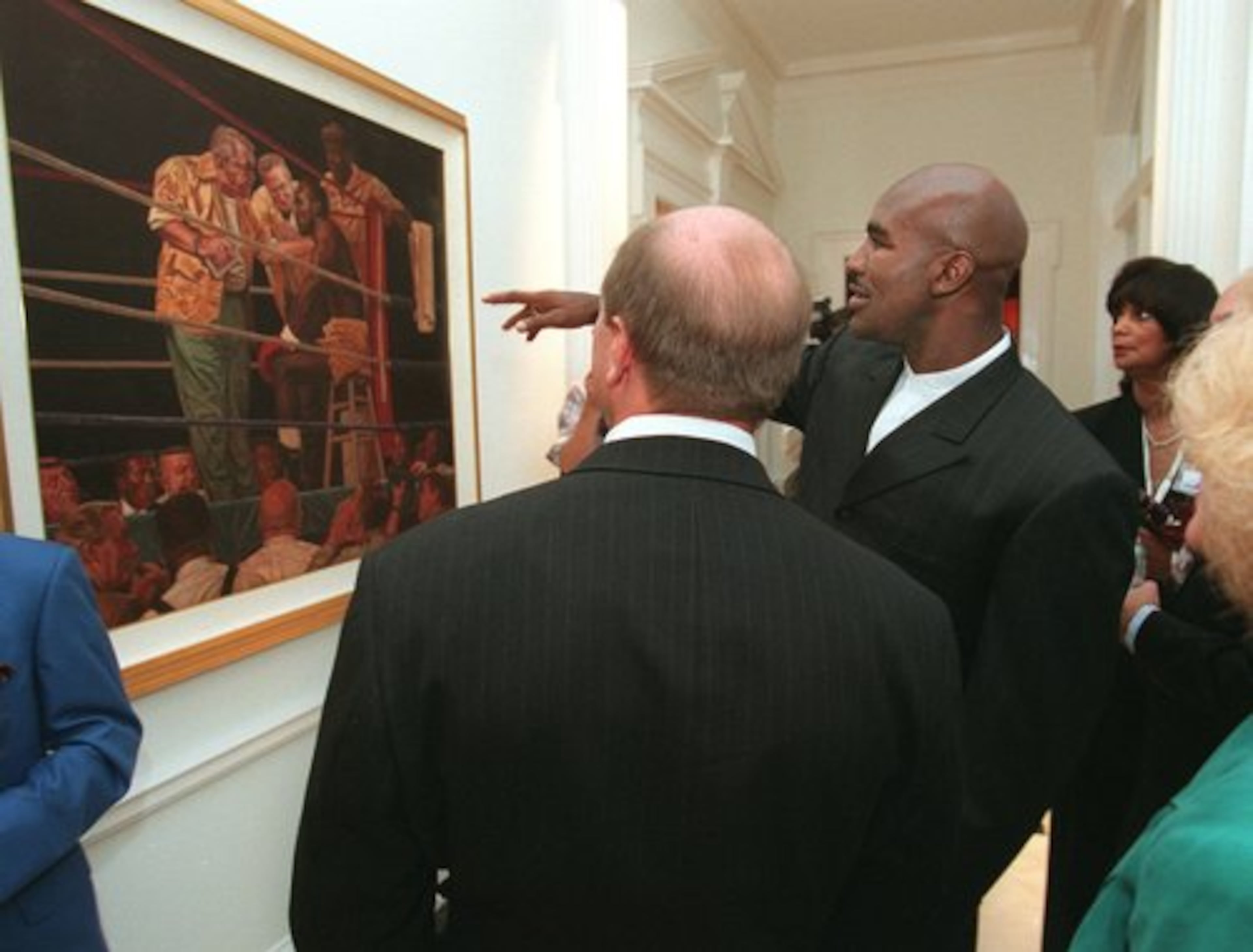 Holyfield takes guests on a tour of his home in 1997.