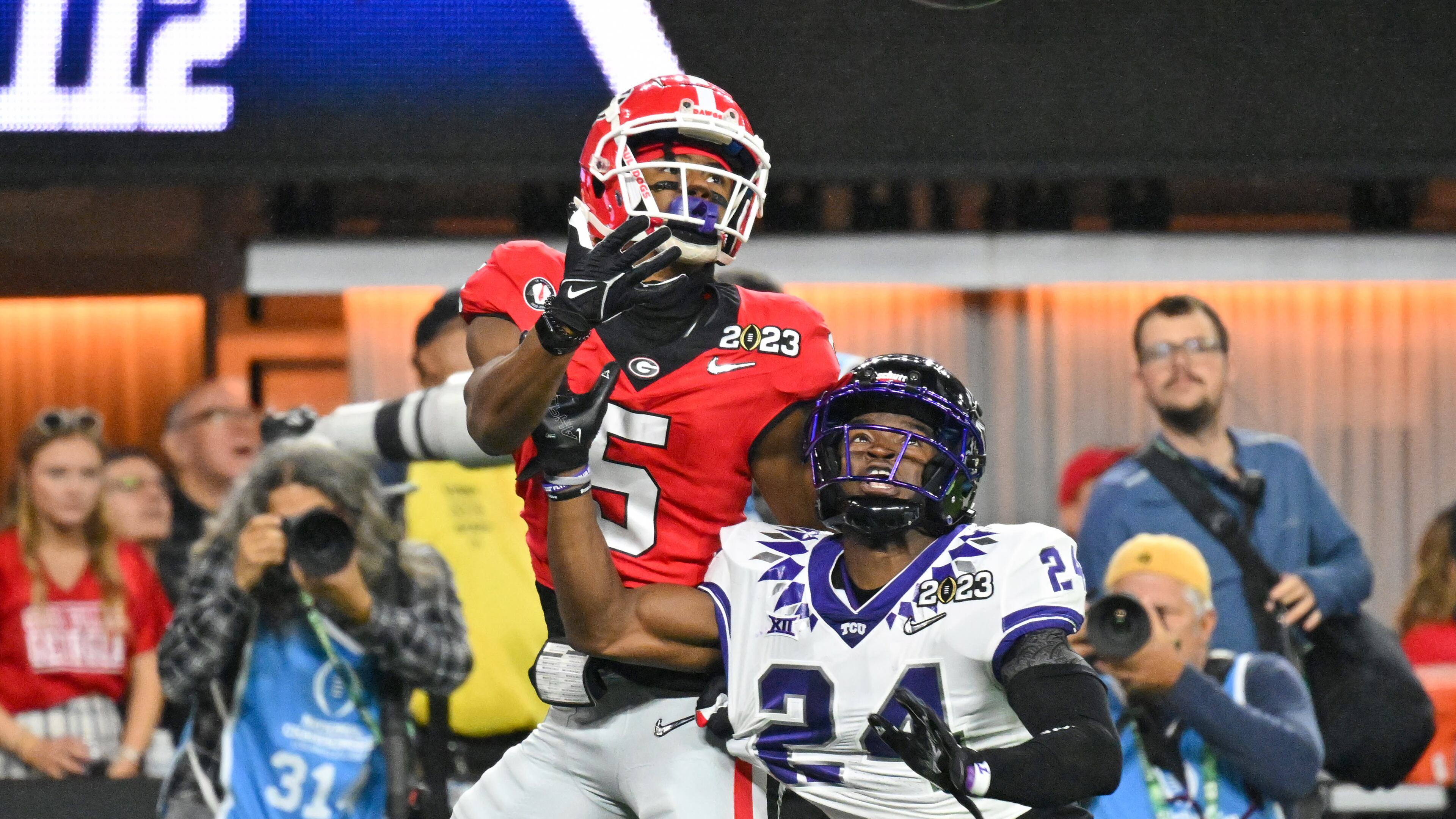 Bulldogs wide receiver Adonai Mitchell makes a touchdown reception over Horned Frogs cornerback Josh Newton during the first half of the College Football Playoff Championship game on Jan. 9 at SoFi Stadium. Mitchell entered his name into the transfer portal Wednesday, according to an unattributed report by DawgsHQ.com. (Hyosub Shin / Hyosub.Shin@ajc.com)